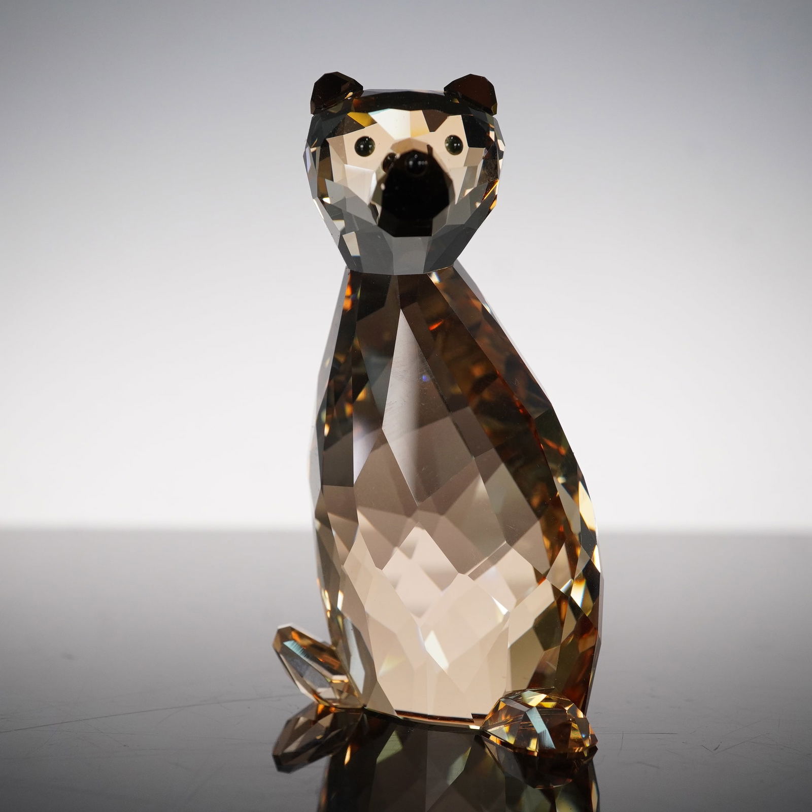 Swarovski Crystal Lovlots Figurine, Ted Bear: Fascinating crystal bear from the City Park theme group. Richly faceted golden brown crystal with dark crystal detailing to the eyes and ears. His muzzle and ears are in Crystal Dorado. Swarovski back