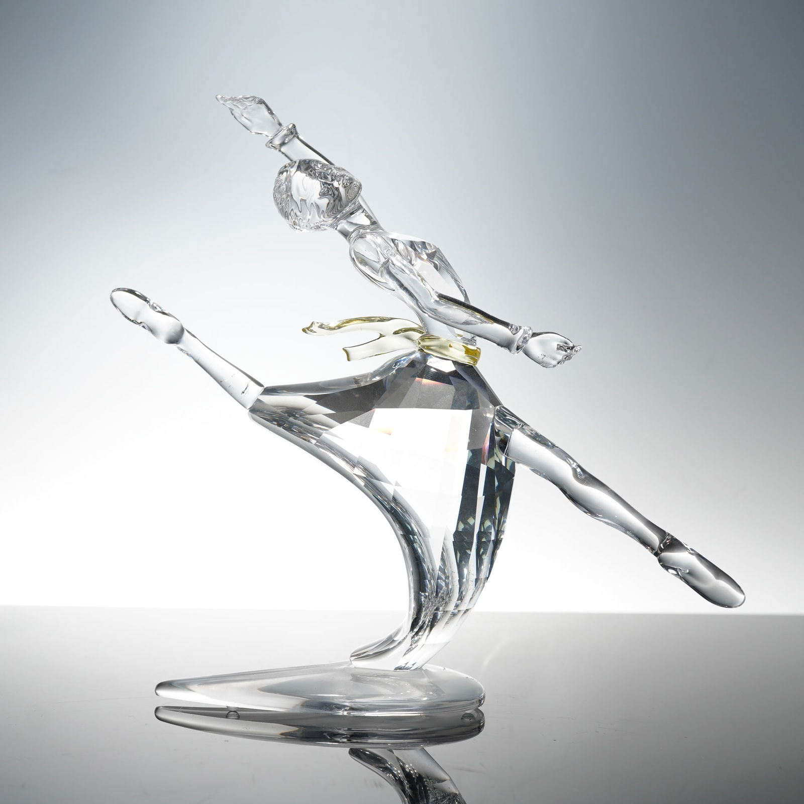 Swarovski Magic of Dance Crystal Figurine, Anna: A masterfully crafted figurine from the renowned Magic of Dance series, depicting "Anna" in an elegant leap that captures the grace and poise of ballet. Expertly rendered in clear faceted crystal, thi