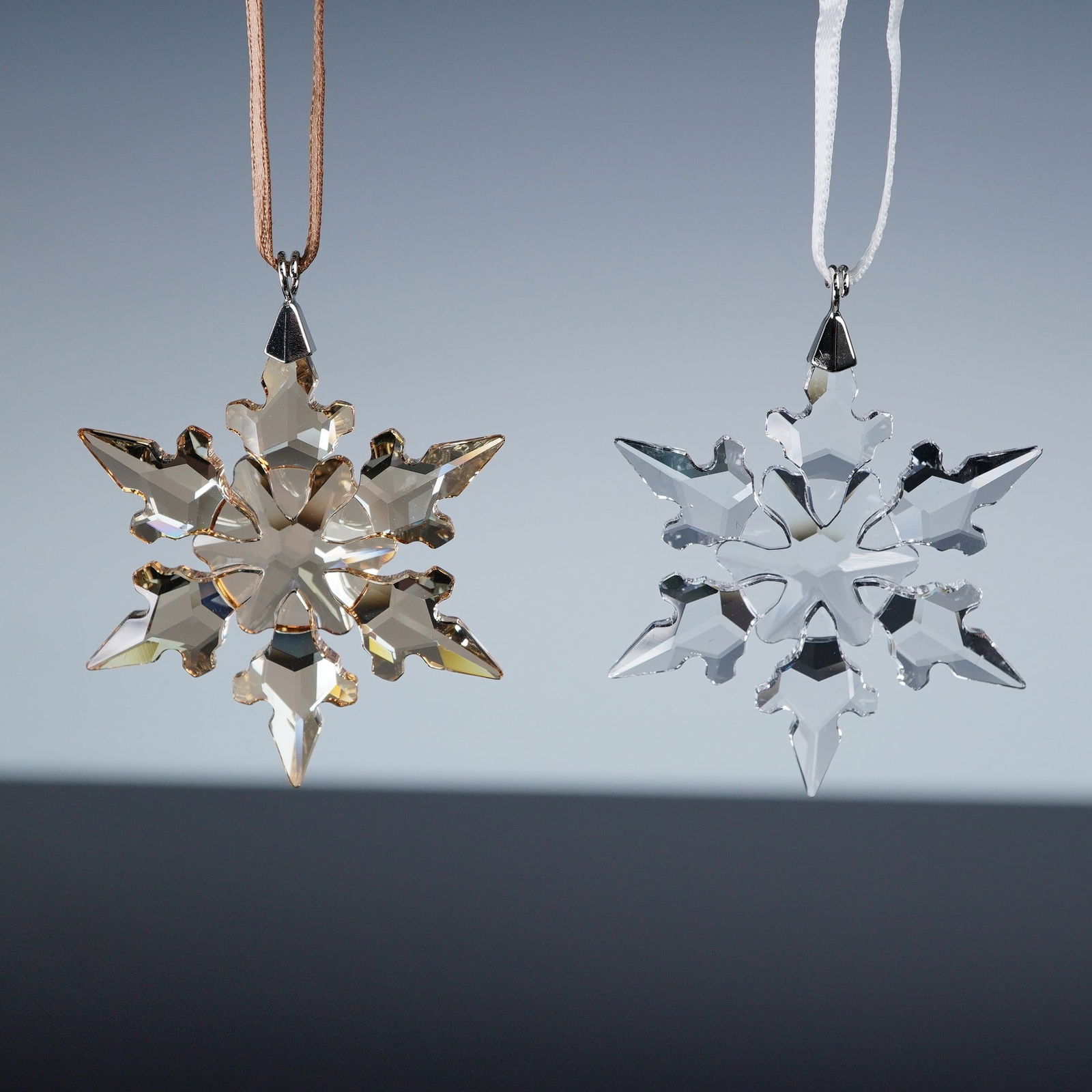 2pc Swarovski Christmas Ornaments: A pair of Swarovski crystal Christmas ornaments, including the 2015 Christmas Ornament Little 5100235 and the 2020 Christmas Ornament Gold Festive Little 5489198. The 2015 edition sparkles in classic
