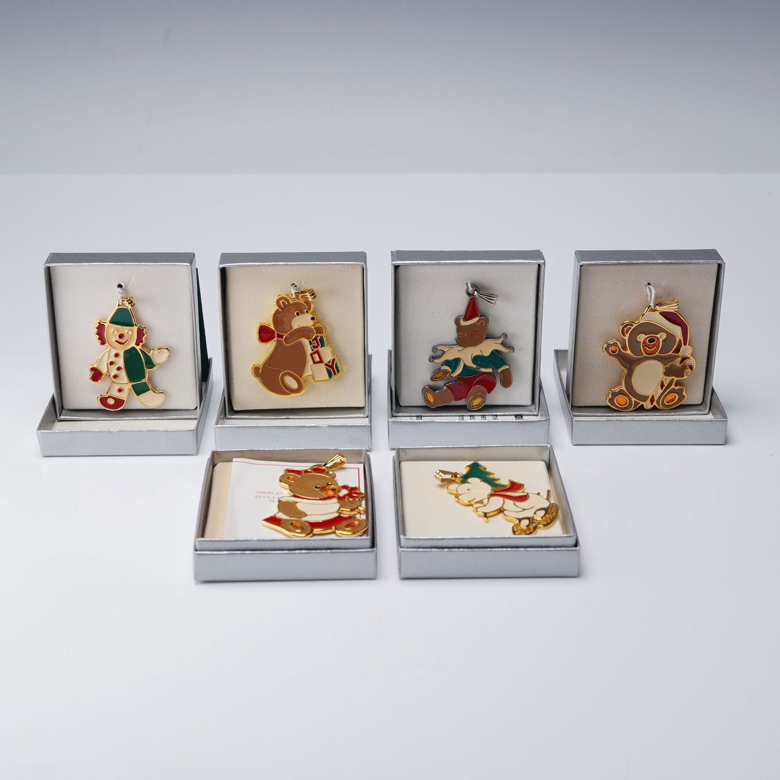 6pc Wallace Silversmiths Enameled Christmas Pendants: A delightful collection of six silver plate and gold plate ornaments, each exquisitely hand-painted with lustrous enamel in festive hues. The set includes whimsical figures like Polar Bear, Baby Bear,
