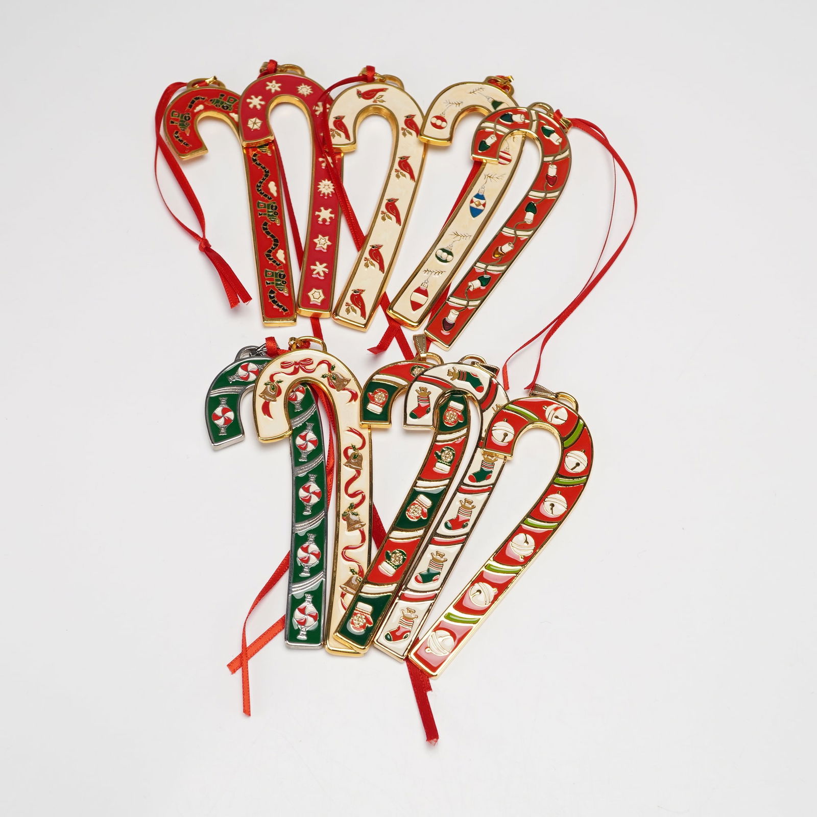 10pc Wallace Silversmiths Annual Candy Cane Ornaments: This festive 10 piece collection features Wallace Silversmiths Annual Candy Cane ornaments from the years 2000 through 2006, 2013, 2015, and 2016. Each ornament shines with gold or silver finish and c