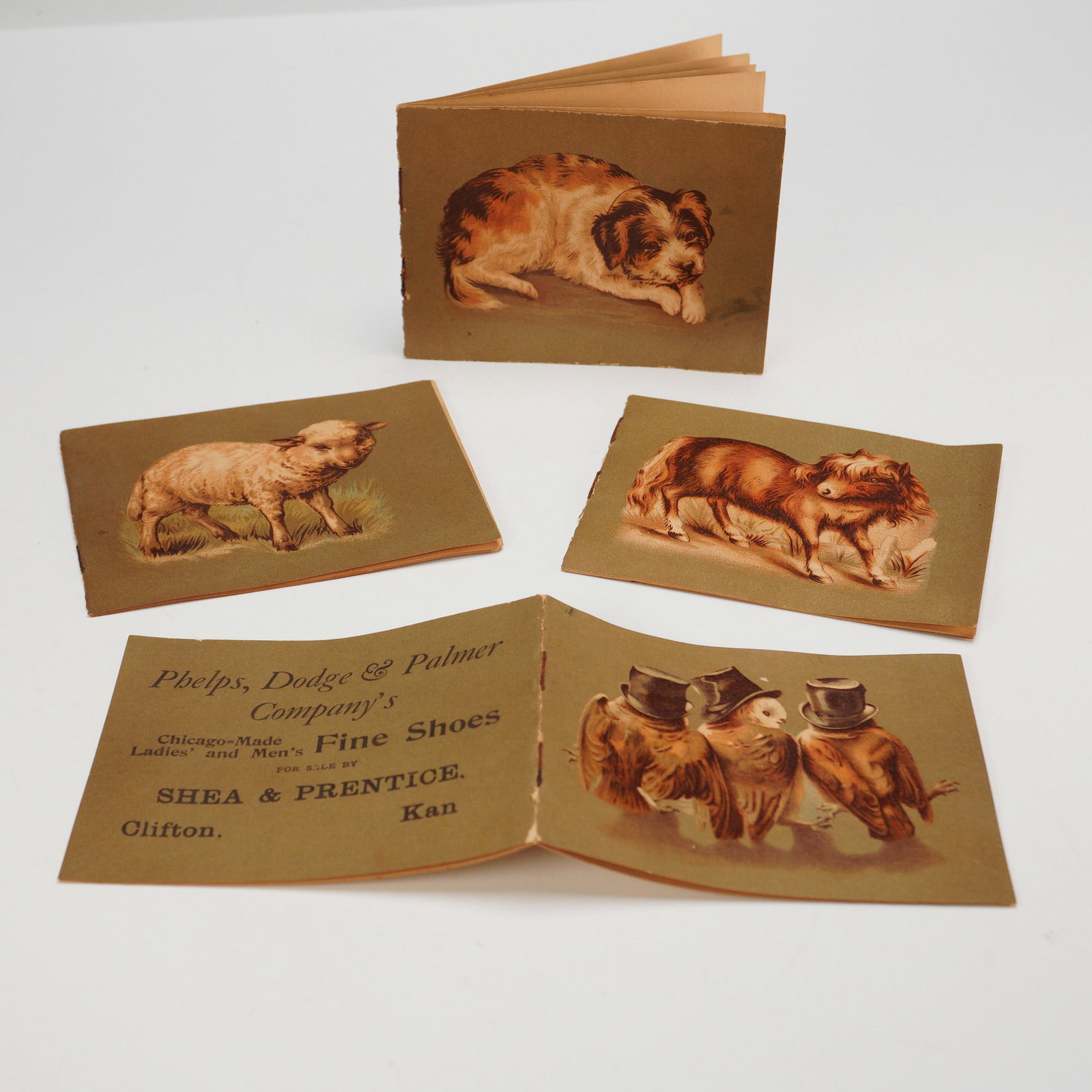 4pc Antique Advertising Shoe Booklets - Phelps, Dodge & Palmer Co.: This lot features four antique advertising booklets from the Phelps, Dodge & Palmer Company, known for their Chicago-made fine shoes. Each booklet showcases a different story, paired with charming ill