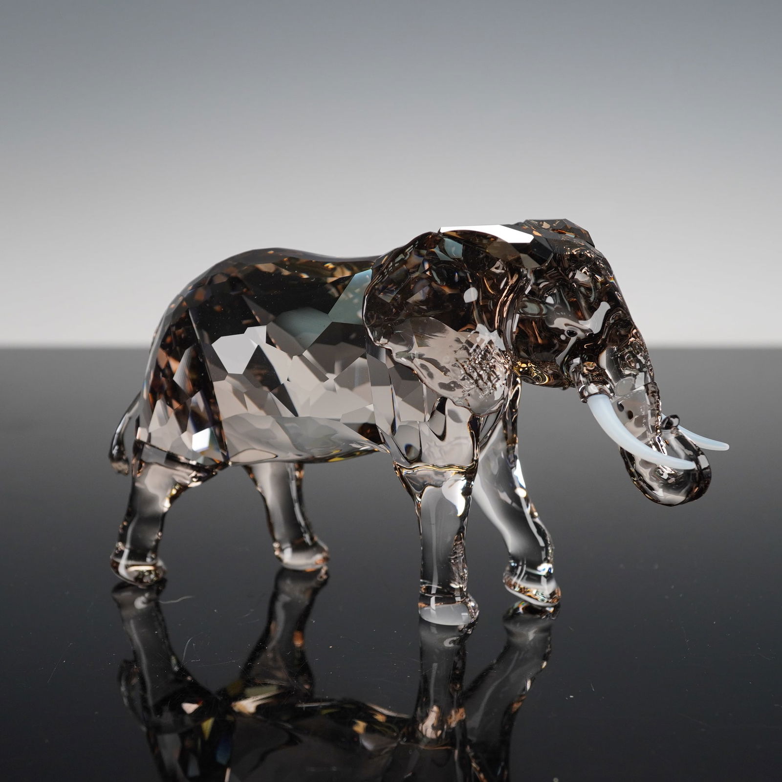 Swarovski Crystal Figurine, Zena: Issued as the 2022 SCS Jubilee Edition, commemorating 35 years of the Swarovski Crystal Society. Crafted in greige crystal with dual coatings for enhanced depth, featuring black crystal eyes and white