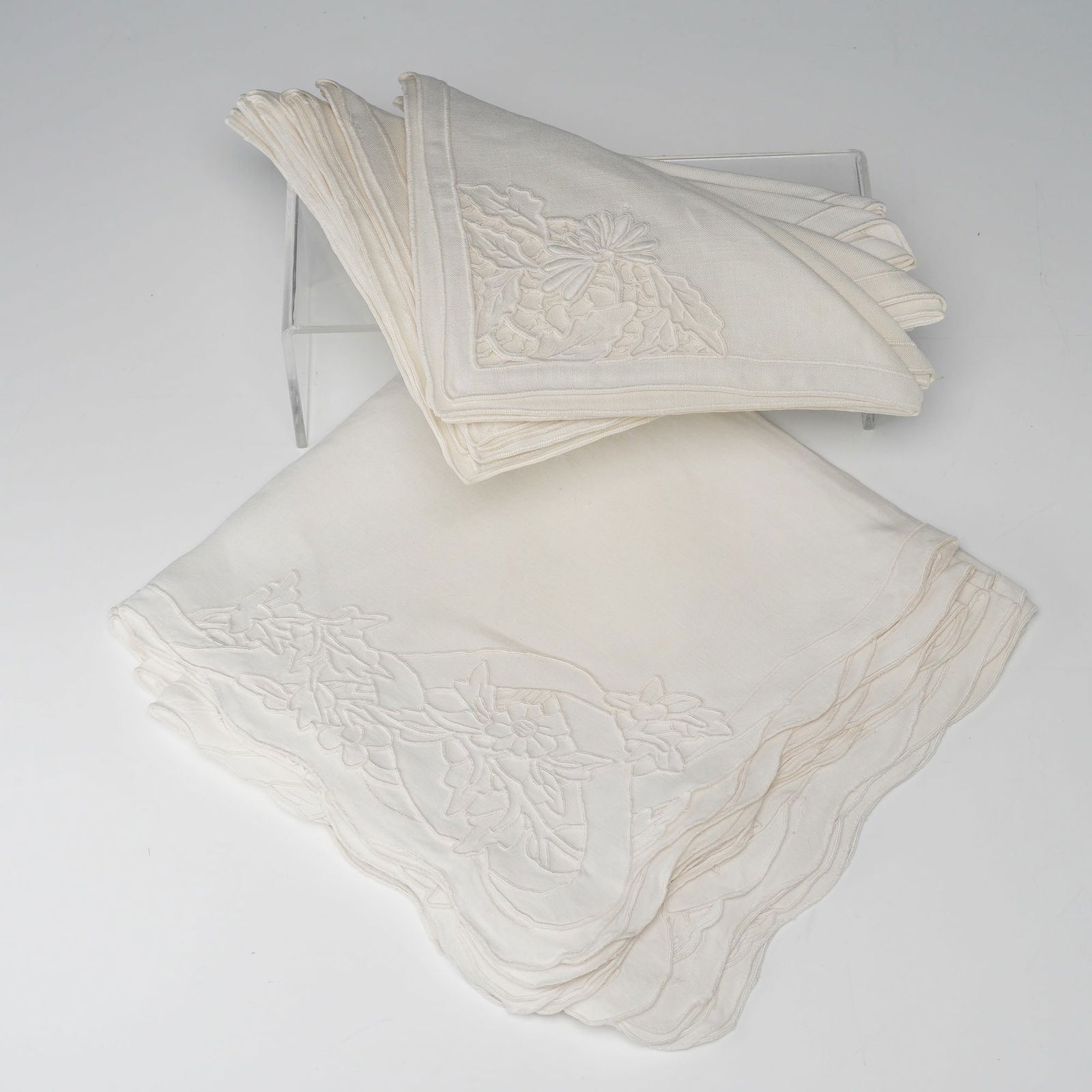 15pc Linen Embroidered Dinner Napkins: A lovely set in two sizes, including eight measuring approximately 13 inches and seven measuring approximately 16 inches. Each napkin is finely crafted in soft ivory-toned linen and features delicate