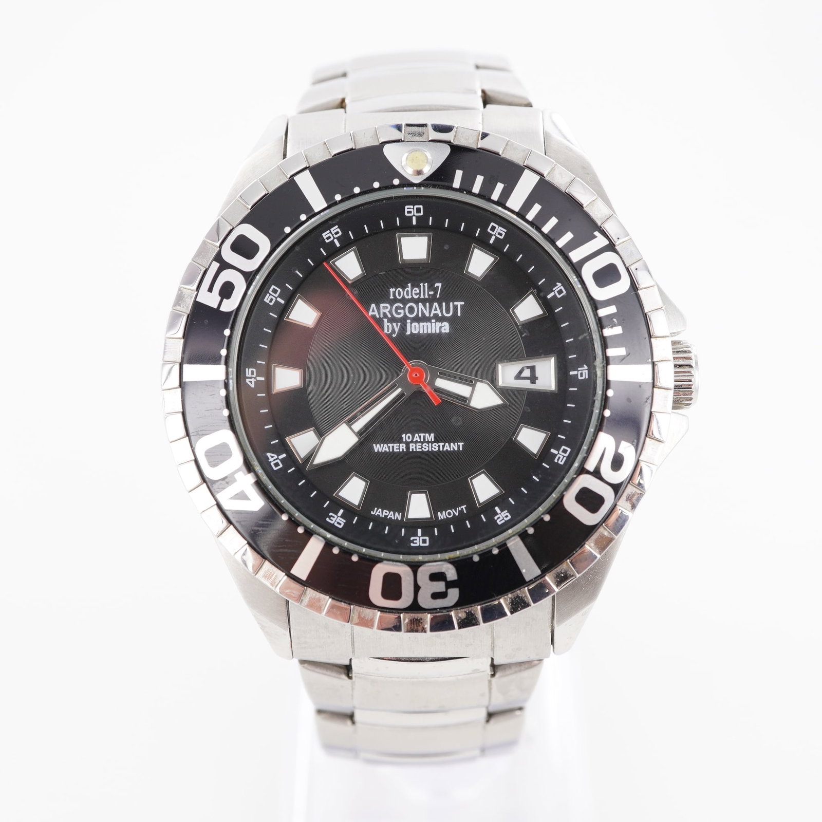 Rodell-7 Argonaut by Jomira Stainless Steel Wristwatch: Stainless steel Rodell-7 Argonaut wristwatch by Jomira featuring a black dial with luminous hands and hour markers, red second hand, and date aperture at 3 o'clock. Rotating black bezel with silver nu