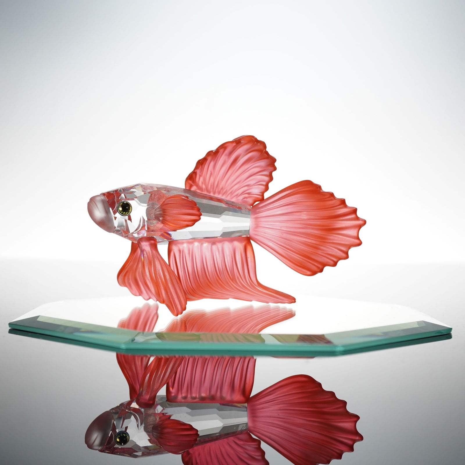 Swarovski Crystal Figurine, Siamese Fighting Fish Red: Brilliantly executed figurine depicting a Siamese fighting fish (Betta splendens) in vivid red. The body is crafted in faceted clear crystal, contrasted with satin-finished red crystal fins that captu