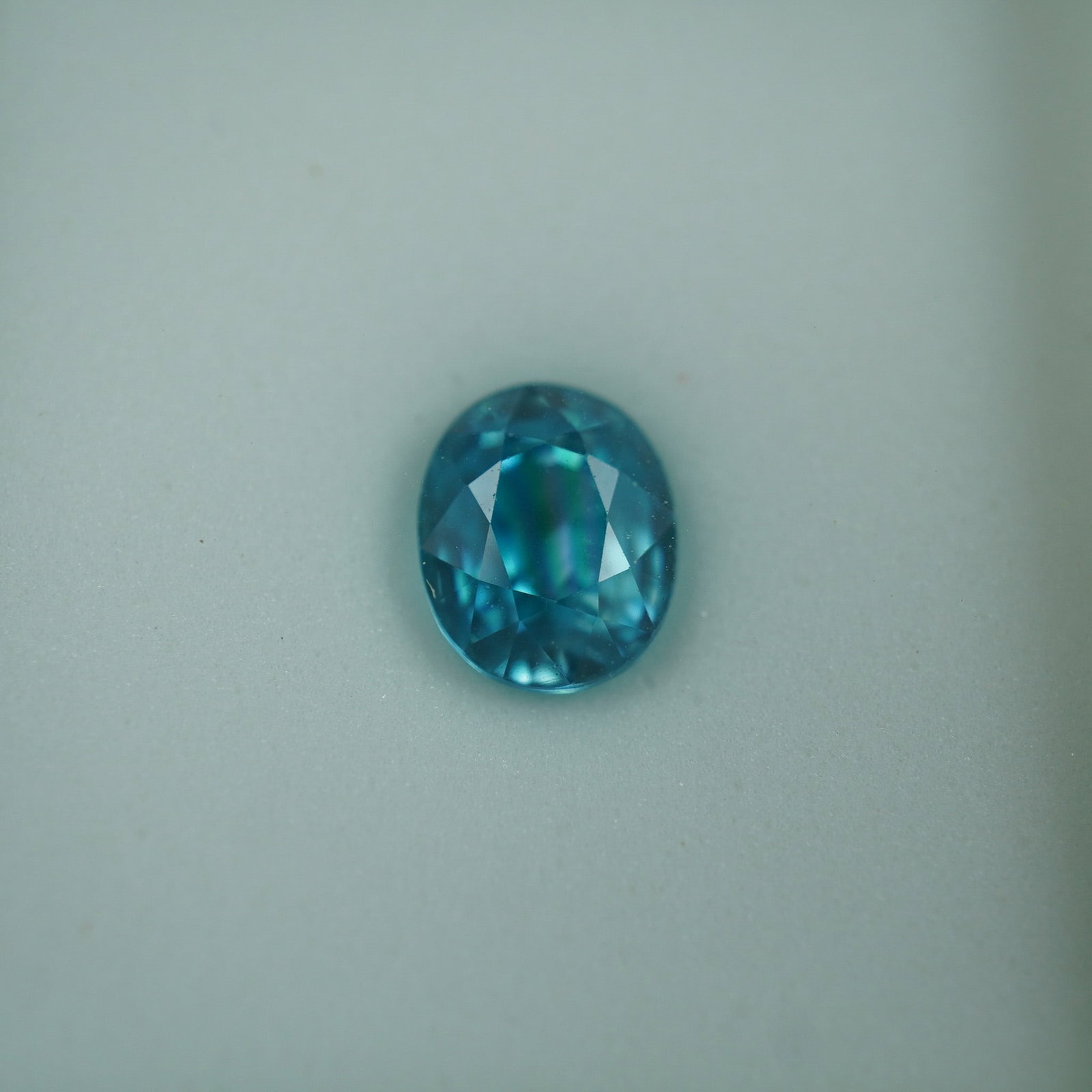 2.75 CT Blue Zircon Oval Cut Gemstone: Brilliant natural blue zircon gemstone with vivid saturation and exceptional brilliance. This oval cut gem weighs approximately 2.75 carats and exhibits a lively sparkle with striking blue hues. Zirco