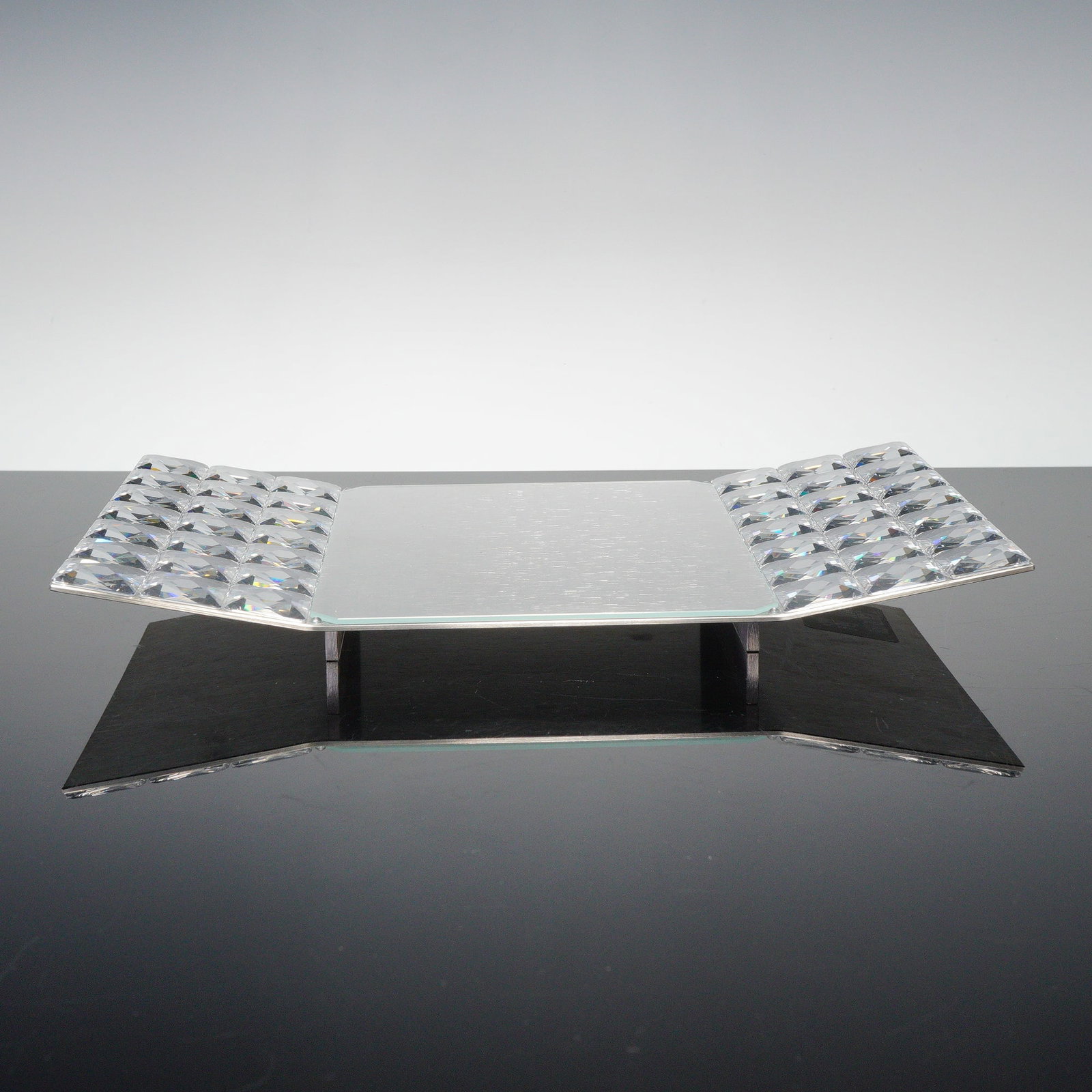 Swarovski Crystal Dressed Up Sushi Plate by Angelika Mohrlein: This Swarovski crystal sushi plate, designed by Angelika Mohrlein, features multi-faceted crystal elements on each end of the rectangular plate, showcasing the brand's renowned craftsmanship. Part of 