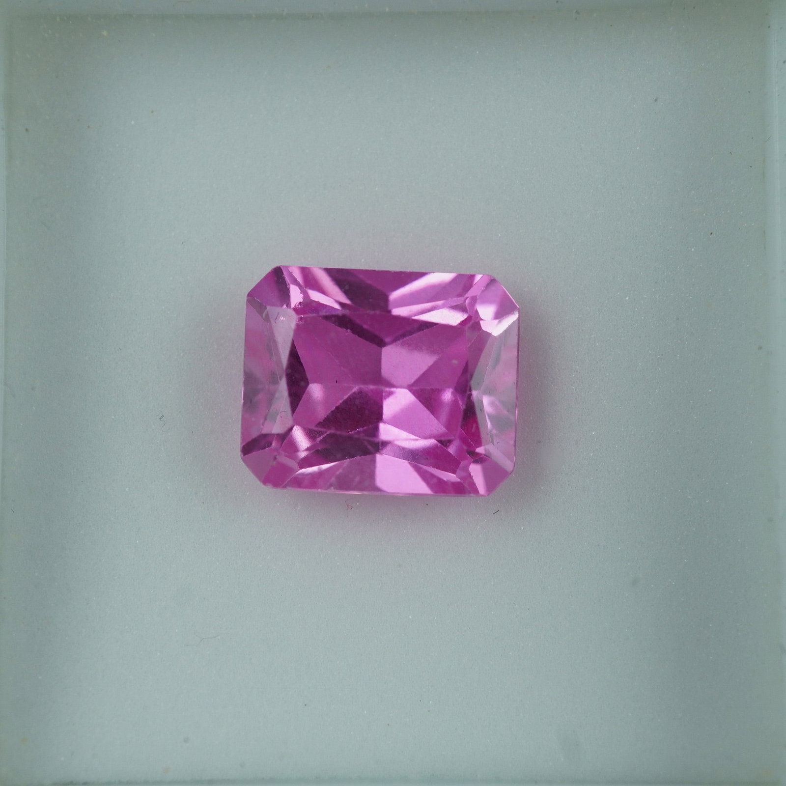 4.00 CT Lab-Created Pink Sapphire Emerald Cut Gemstone: Lab-created pink sapphire in a vibrant emerald cut, showcasing excellent clarity and brilliance. This eye-catching gem offers the beauty of natural sapphire at an accessible price, perfect for bold je