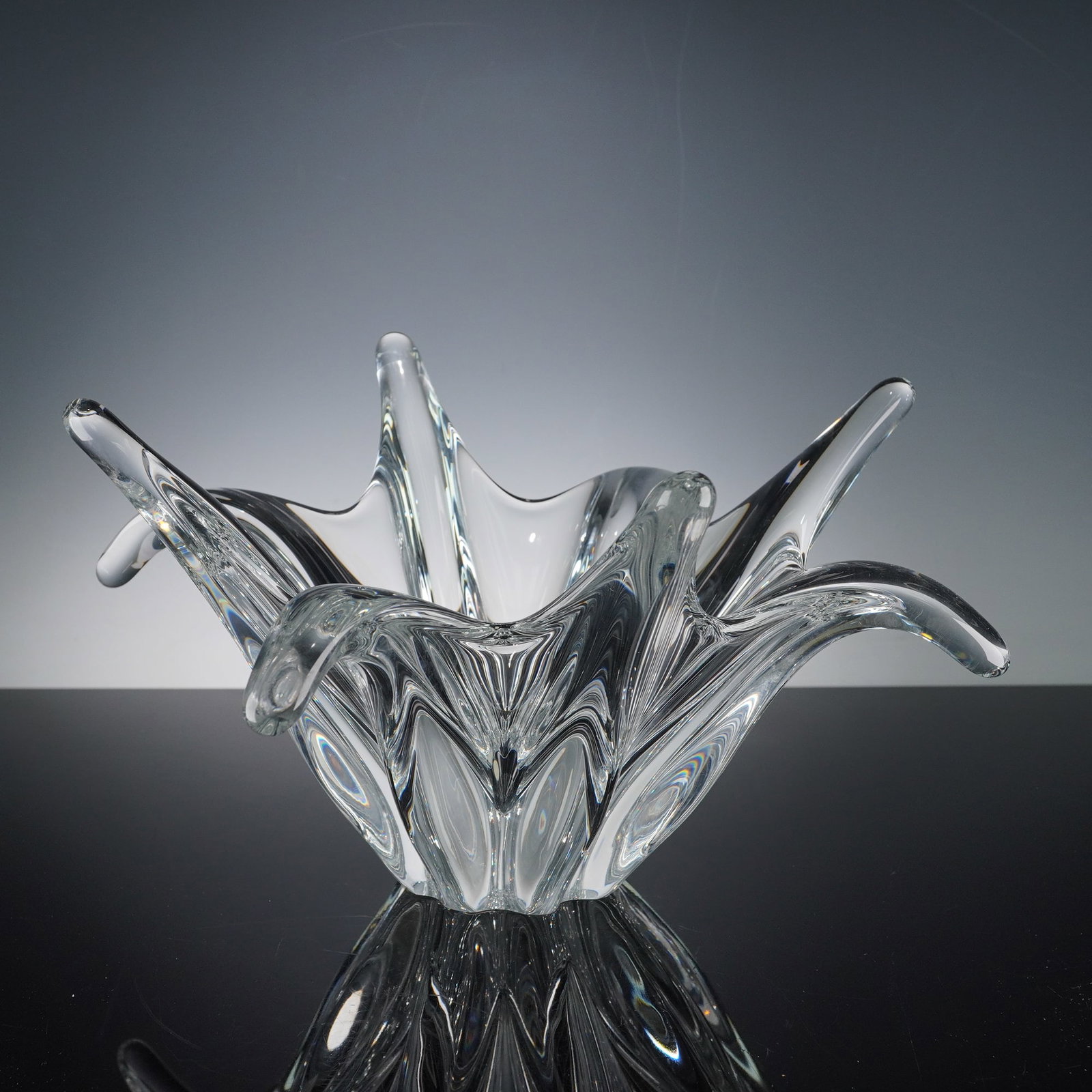Baccarat Octopus Crystal Bowl: A sculptural bowl by Baccarat features a fluid, organic form. Crafted from clear lead crystal. The piece bears the etched Baccarat France hallmark on the base, confirming its authenticity and heritage