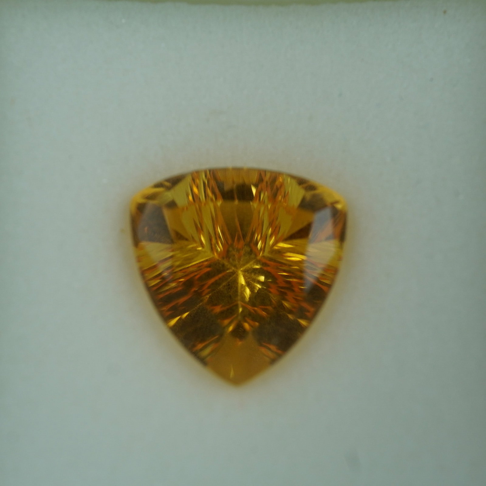 4.90 CT Citrine Trillion Cut Gemstone: This radiant citrine gemstone features a striking golden hue and an expertly executed trillion cut in the advanced quantum style, designed to enhance brilliance and light dispersion. Weighing approxim