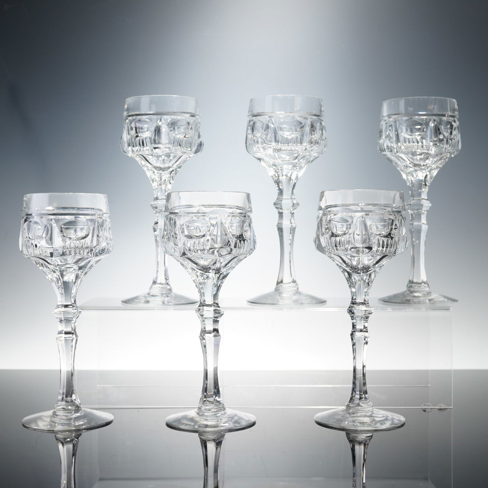 6pc Cut Crystal Wine Glasses: A fine set of six cut crystal wine goblets, each featuring deeply hand-cut geometric facets that catch and refract the light beautifully. The glasses display a classic baluster stem rising to a broad,
