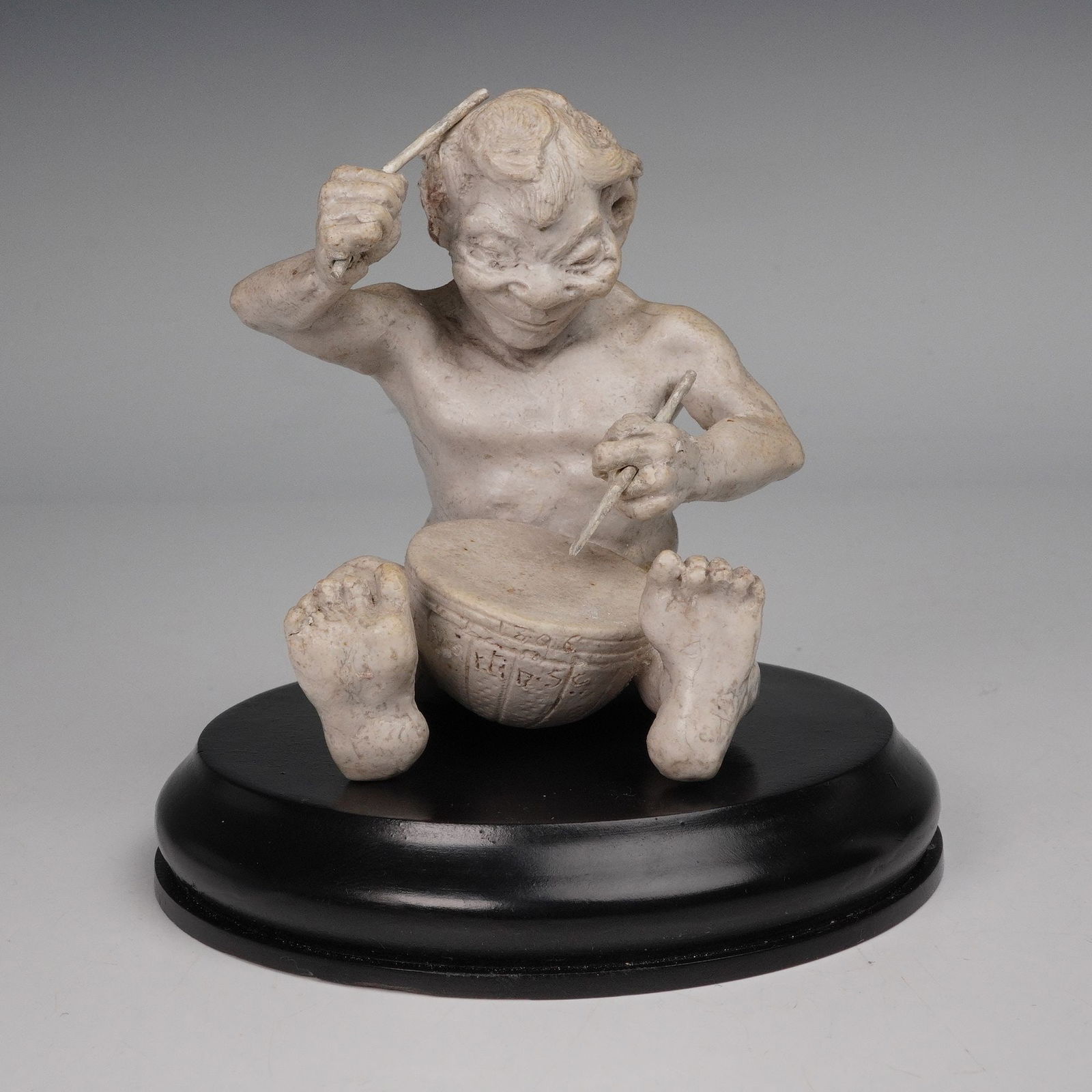 Martin Brothers Potters Stoneware Figurine, Imp Musician - The Drummer: The hand-modeled imp is shown seated and playing a drum with two sticks, rendered with detailed musculature, facial expression, and textured skin typical of the Martin Brothers' grotesque style. The f