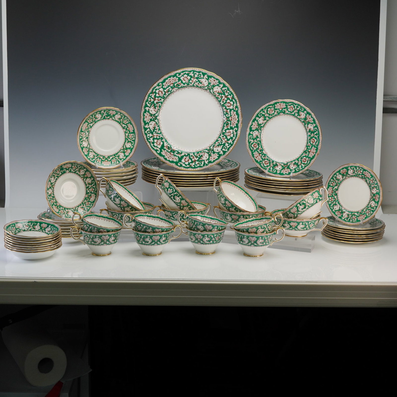 64pc Crown Staffordshire Dinnerware Service for Eight, Ellesmere Green: A fine 64 piece Crown Staffordshire bone china dinnerware service for eight in the elegant Ellesmere Green pattern, featuring a rich emerald green border adorned with an intricate floral and bird desi