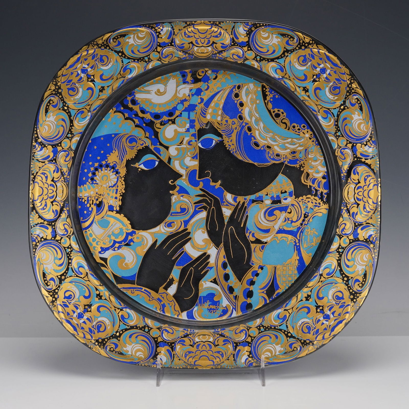 Rosenthal Studio Line by Bjorn Wiinblad Weihnachten Glass Wall Plate: Glass wall plate designed by Bjorn Wiinblad for the Weihnachten (Christmas) series, featuring a richly detailed scene of two stylized figures in conversation surrounded by swirling abstract motifs. Th