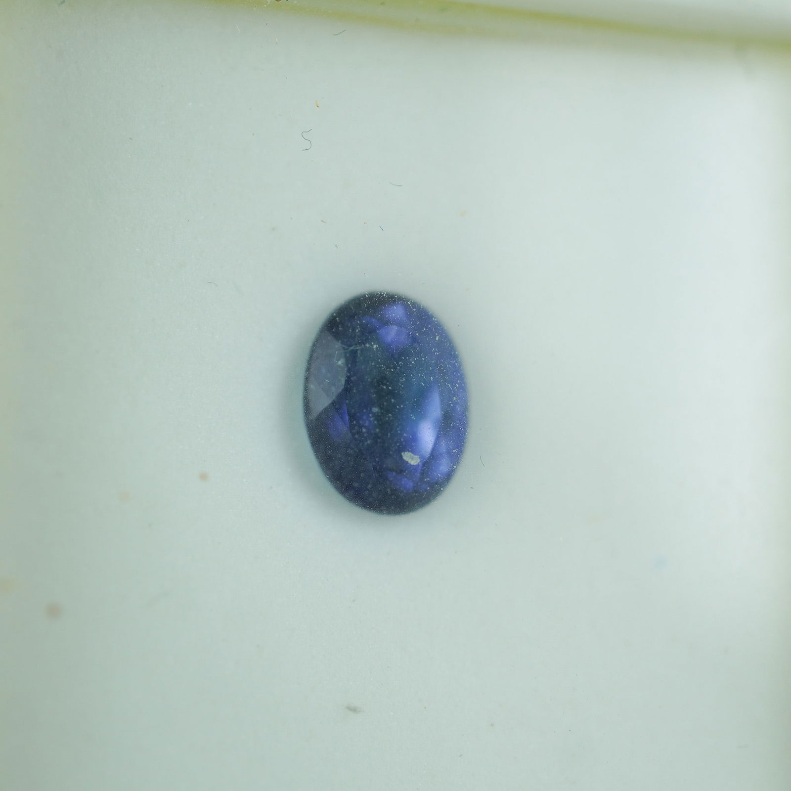 1.75 CT Patriot Blue Topaz Oval Cut Gemstone: Captivating 1.75 carat Patriot Blue topaz gemstone with an oval cut, showcasing a deep, vivid blue hue with excellent brilliance. This gem's rich color and clarity make it an ideal choice for elegant