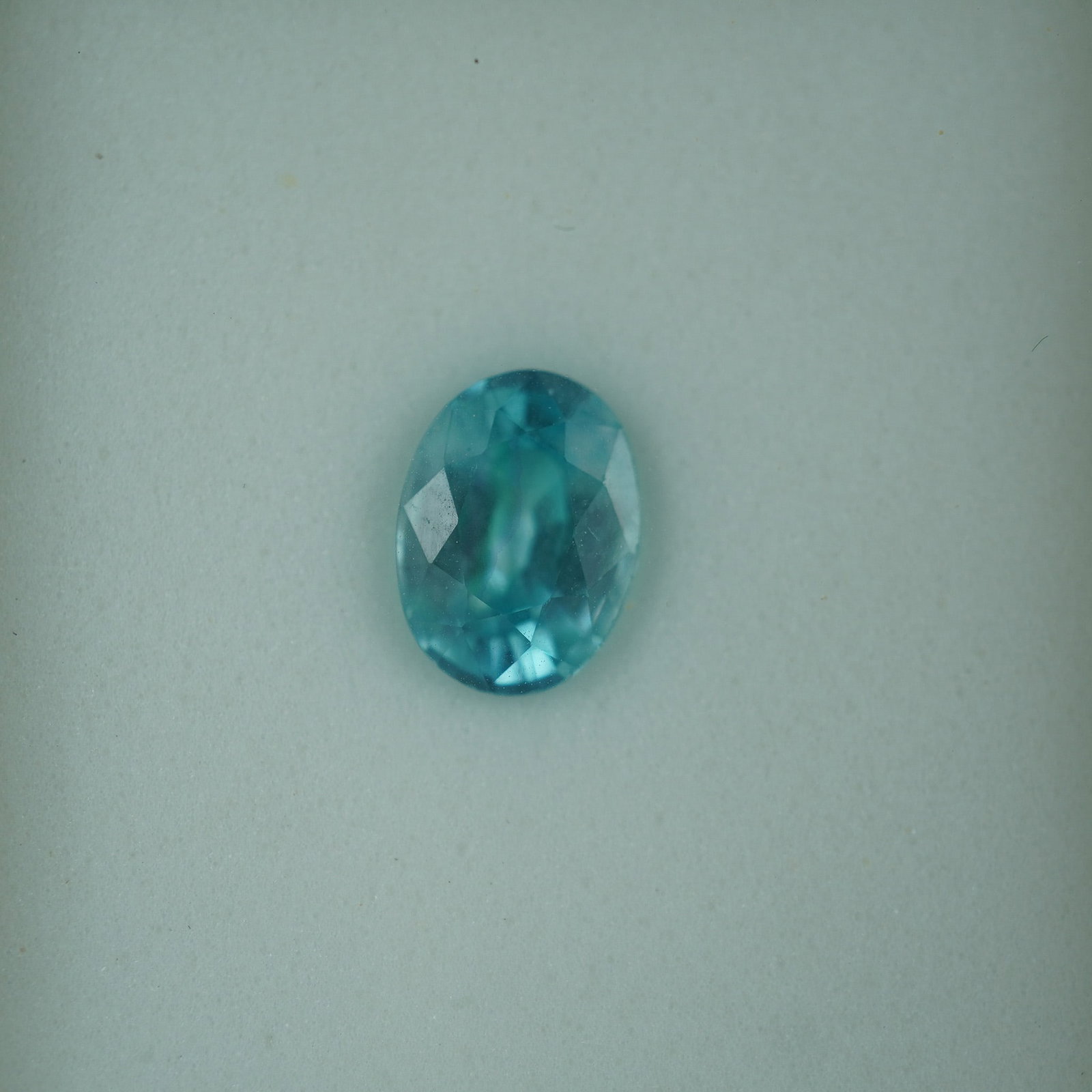 1.85 CT Blue Zircon Oval Cut Gemstone: Brilliant 1.85 carat blue zircon gemstone in a classic oval cut. This natural zircon displays a vibrant blue hue with lively brilliance and good transparency. Known for its high dispersion and strong 