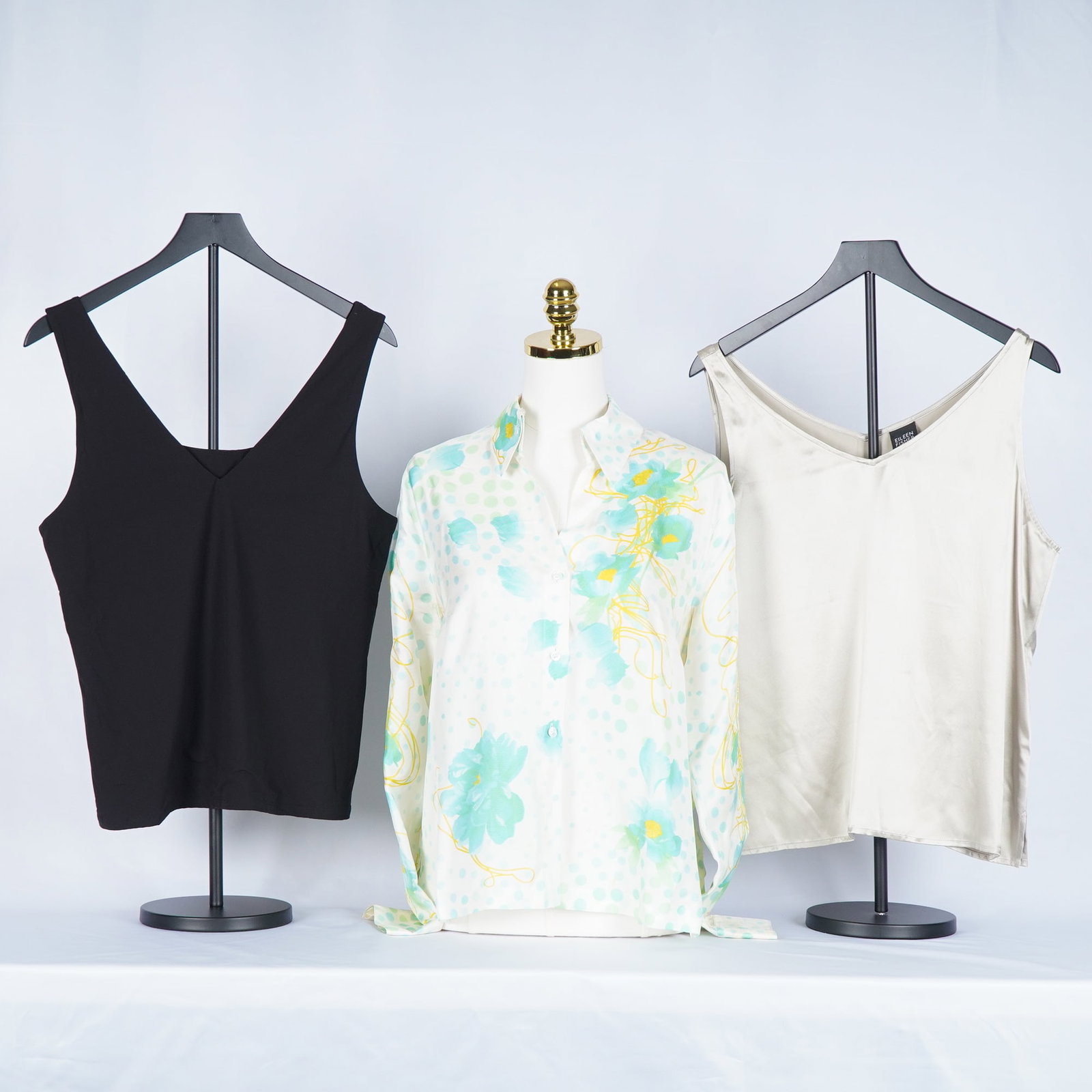3pc Eileen Fisher and Escada Women's Casual Wear, Camisoles and Blouse: Women's casual tops including a black V-neck stretch camisole, a champagne silk camisole by Eileen Fisher, and a vibrant button-front blouse by Escada featuring a soft white base with mint and yellow