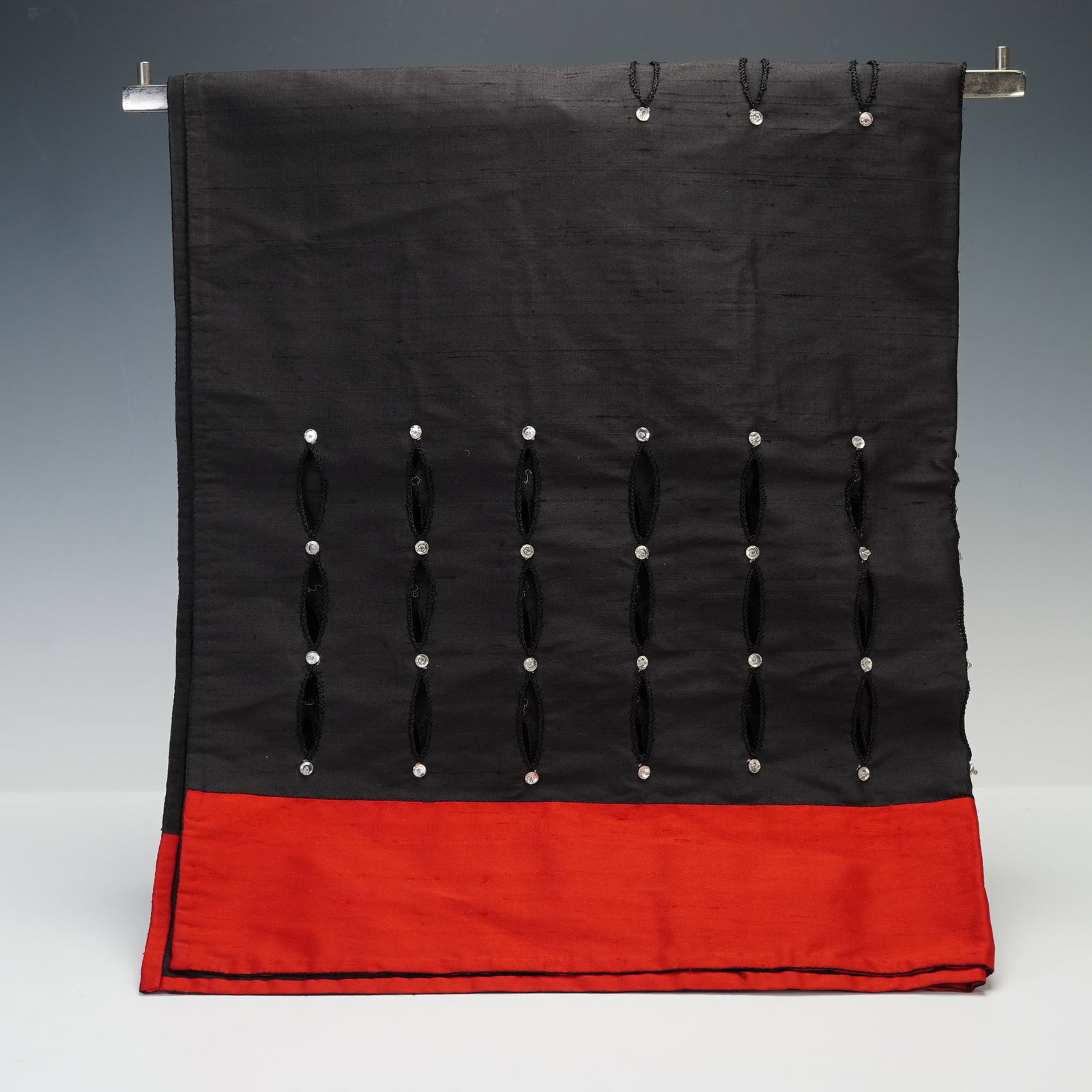 Escada Black and Red Silk Beaded Scarf: A luxurious scarf crafted from fine silk in a striking black and red palette. The design features elegant vertical beaded embellishments accented with clear crystal details, adding refined texture and