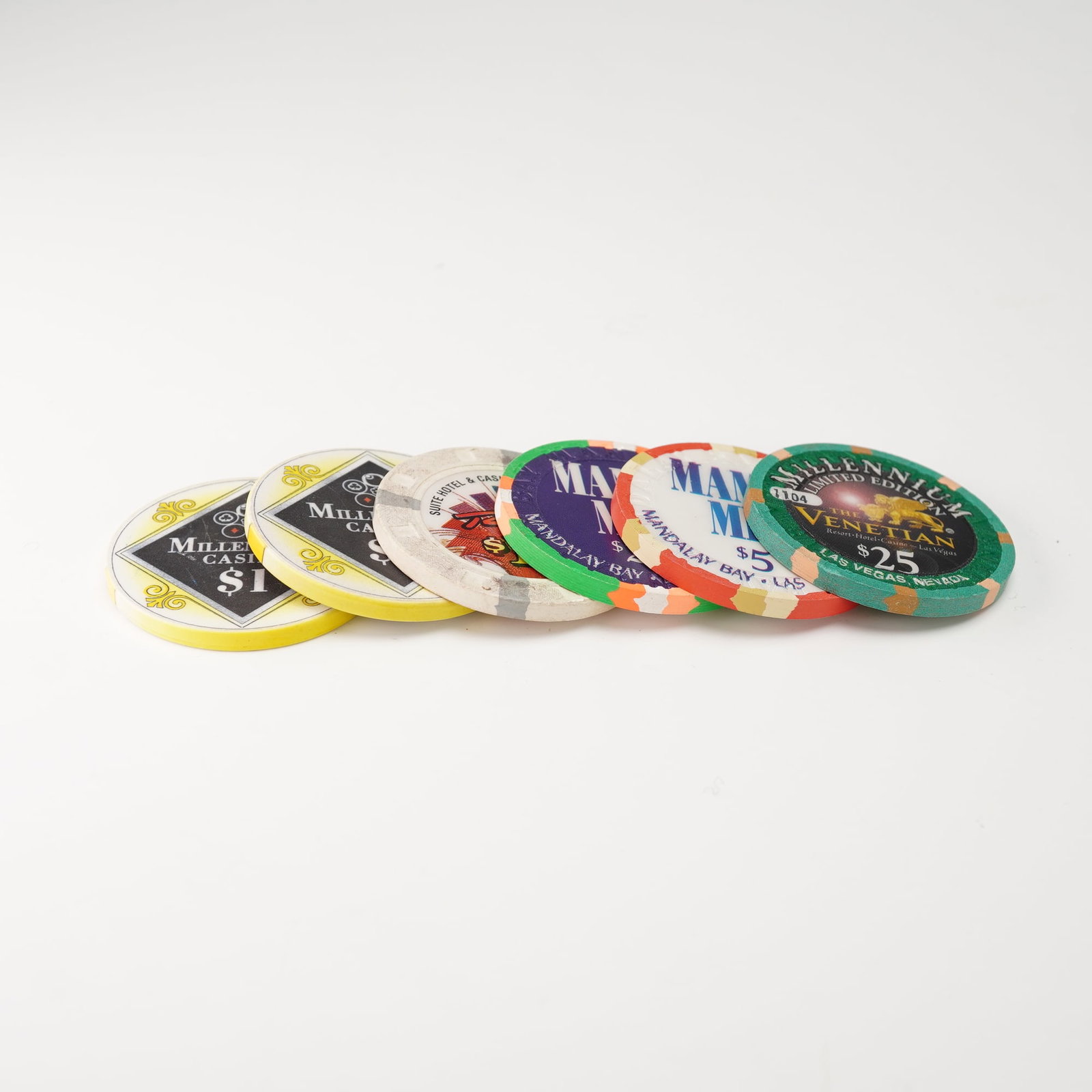 6pc Las Vegas Casino Chips - Venetian Millennium, Mandalay Bay and Casino: Collectible clay casino chips from notable Las Vegas resorts and themed promotions. Includes The Venetian $25 Millennium Limited Edition chip (No. 1104), Mandalay Bay $5 Mamma Mia! chip, Millennium Ca