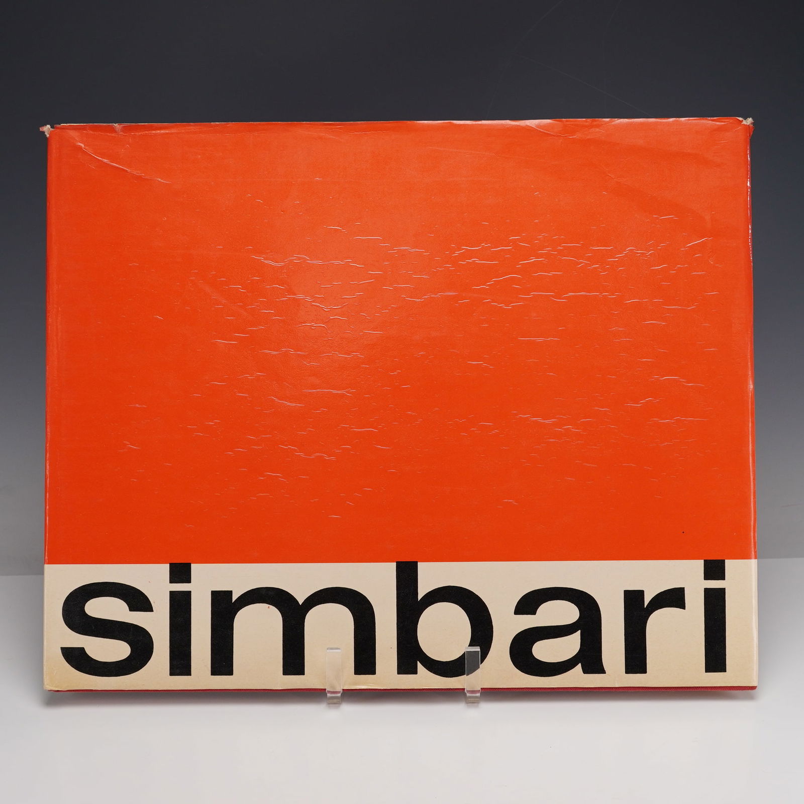 Hardcover Art Book, Simbari: Large oblong folio exhibition monograph featuring the vivid, expressionist works of Italian painter Nicola Simbari. The volume showcases numerous full-page color plates capturing his bold palette and