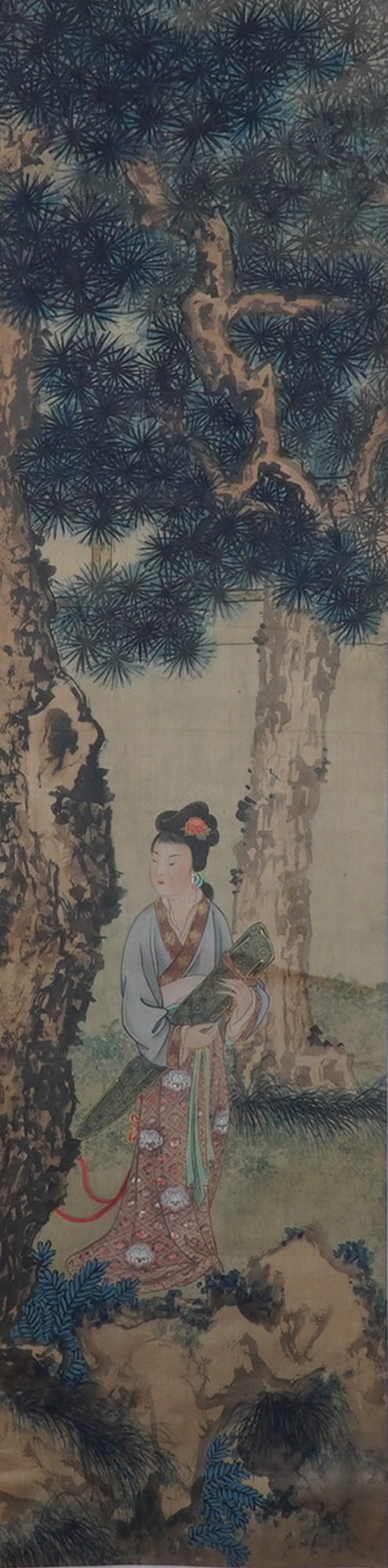 Chinese Ink and Watercolor on Paper Hanging Scroll, Courtly Scene: An elegant Chinese ink and watercolor hanging scroll on paper, depicting a refined court lady standing gracefully beneath tall pines, holding a richly decorated qin (ancient zither). The delicate brus