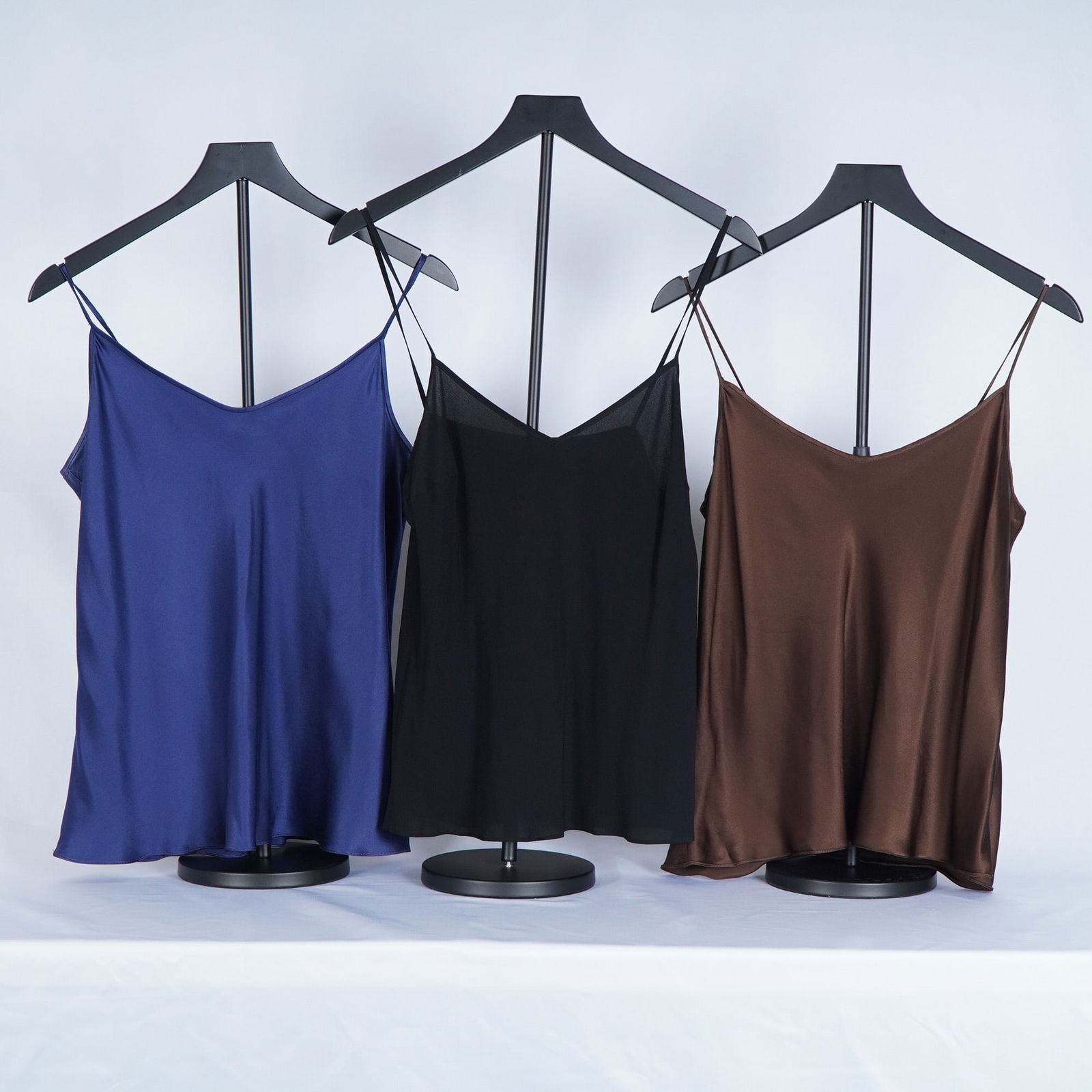 3pc Escada and Pilar Rossi Silk Spaghetti Strap Camisoles: Silk and silk-blend spaghetti strap camisoles including one black Escada cami with soft drape and lightweight construction, paired with two Pilar Rossi silk camisoles in rich sapphire blue and warm ch
