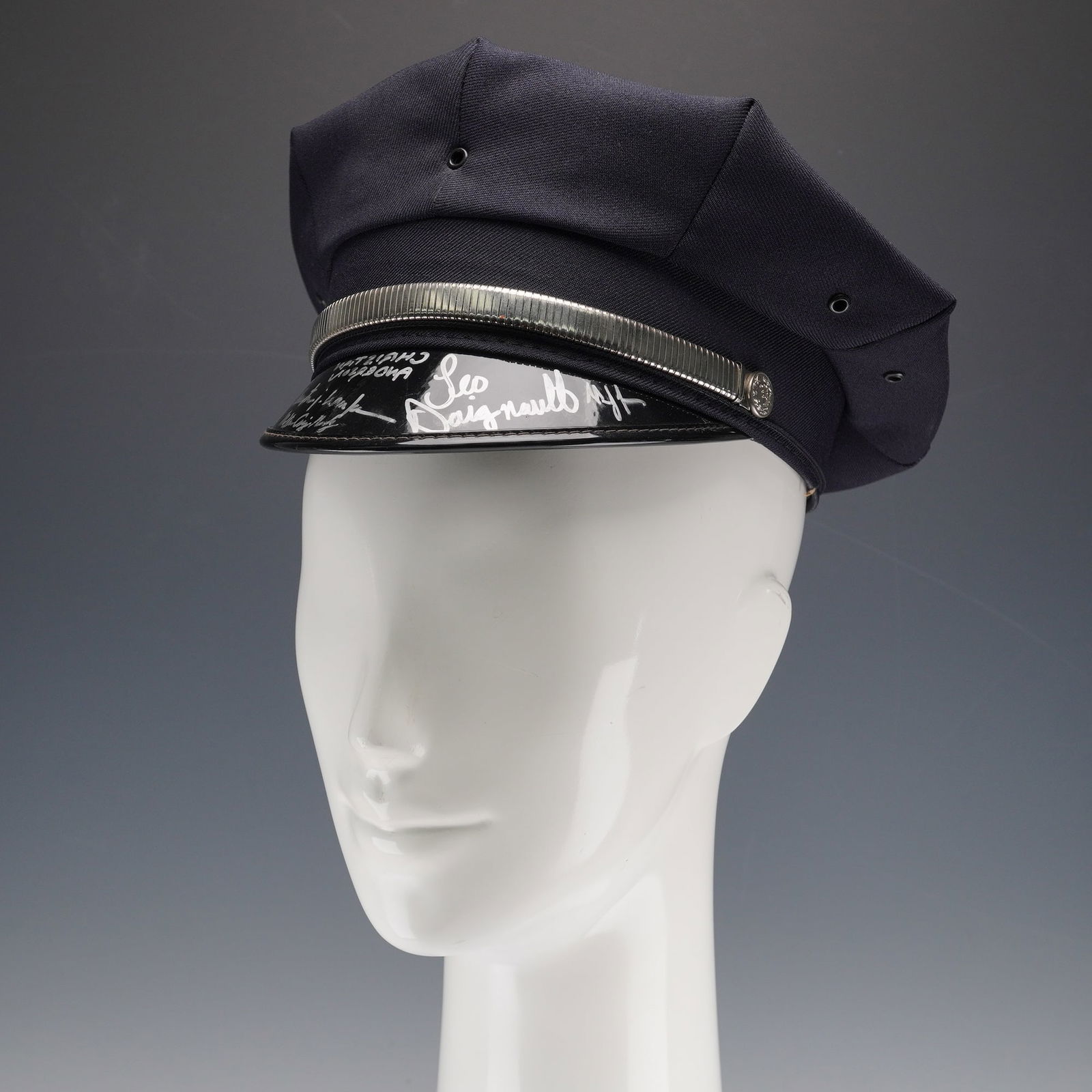 Avenue Q Broadway Production Cast-Signed Police Hat: An original police hat from the Broadway production of Avenue Q, signed in silver marker along the interior visor by cast members Christian Anderson and Leo Daignault, with additional cast inscription