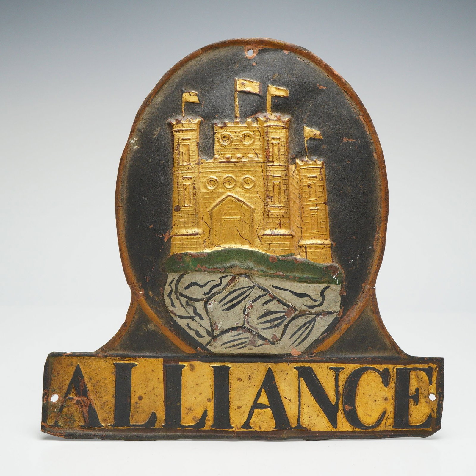 Alliance Fire and Life Insurance Pressed Metal Advertising Plaque: This pressed metal wall plaque was produced for the Alliance Fire and Life Insurance Company and displays the firm name above a raised castle emblem inspired by the historic company crest. Formed from