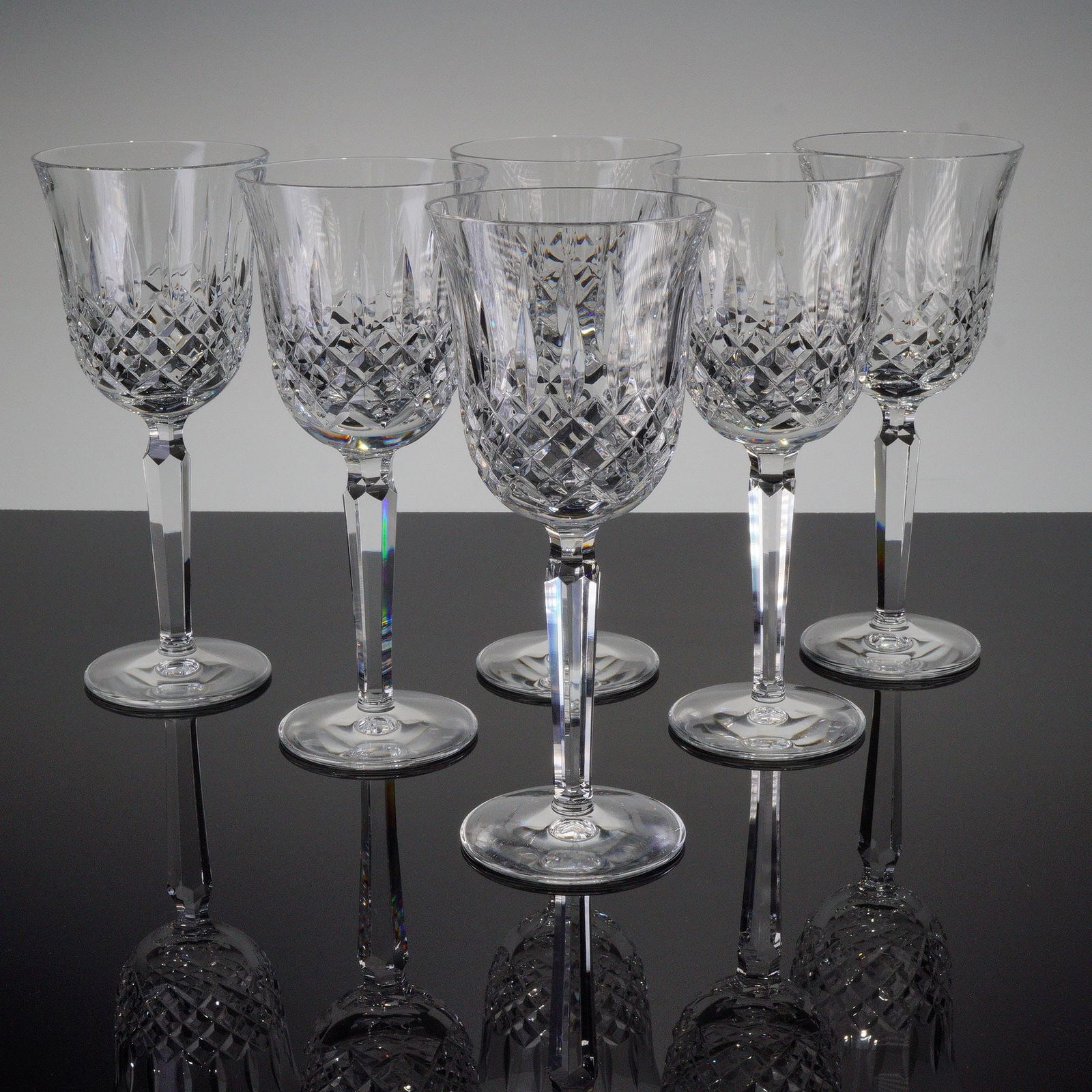 6pc Waterford Crystal Wine Glasses, Kelsey: This set includes six Waterford crystal wine glasses in the Kelsey pattern, featuring a faceted stem and cut bowl design. Each glass carries the Waterford backstamp on the base. Issued: 1995-2018 Dime