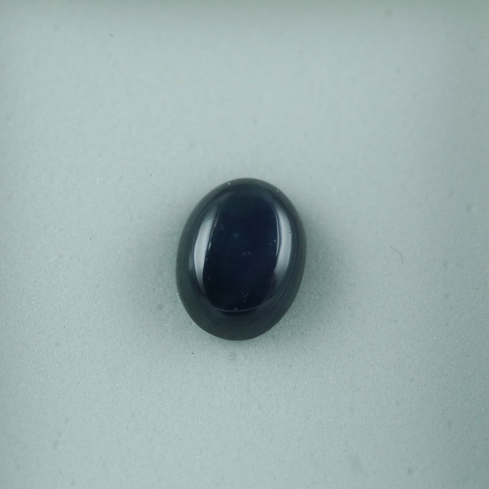 1.60 CT Black Star Sapphire Oval Cabochon Gemstone (1 of 2)