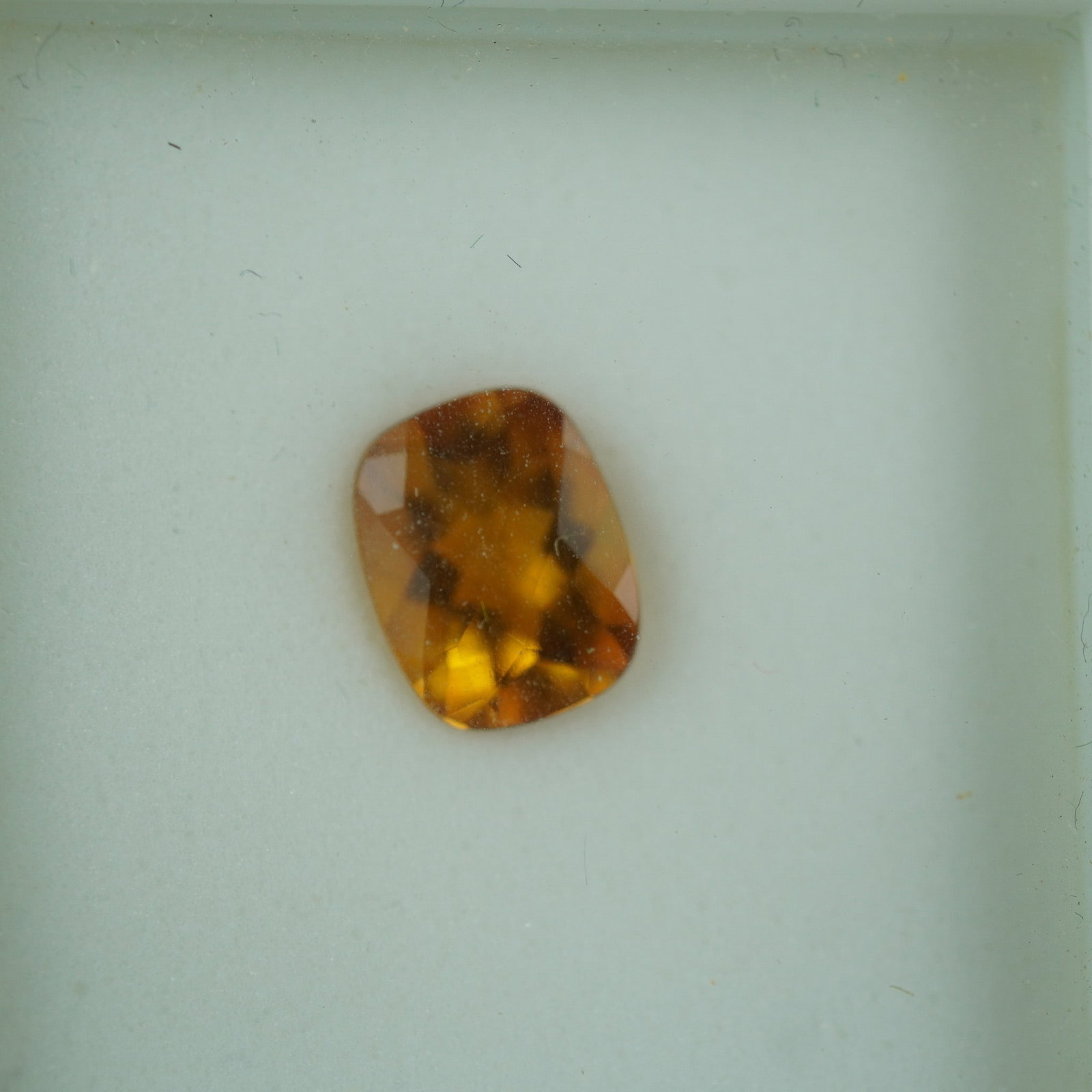 1.90 CT Citrine Cushion Cut Gemstone: This radiant citrine gemstone weighs approximately 1.90 carats and displays a warm golden hue with exceptional brilliance. Expertly cushion cut, it offers a timeless appeal suitable for a variety of j
