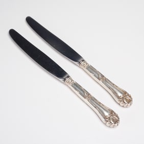 A Pair of 2pc Marked Sterling Handle Stainless Blade Knives