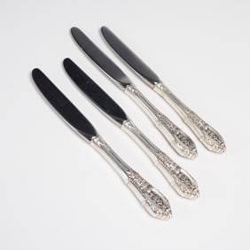 A Collection of Four Wallace Rose Point Sterling Handle Dinner Knives