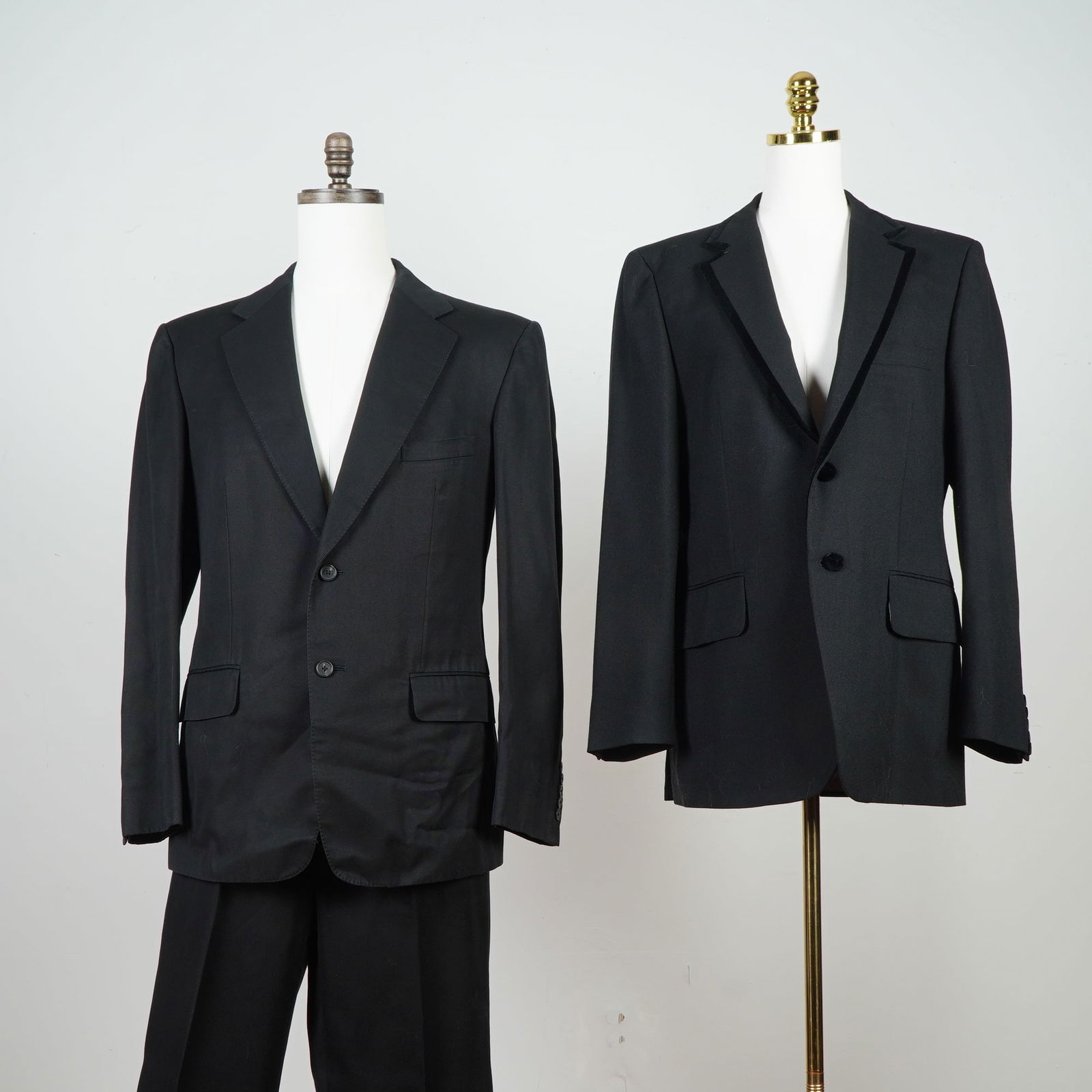 2pc Gucci Black Men's Blazers with Trousers: Two elegant blazers including a single-breasted blazer accompanied by matching trousers, both executed in a smooth suiting fabrication with structured shoulders, notched lapels, and classic pocket det