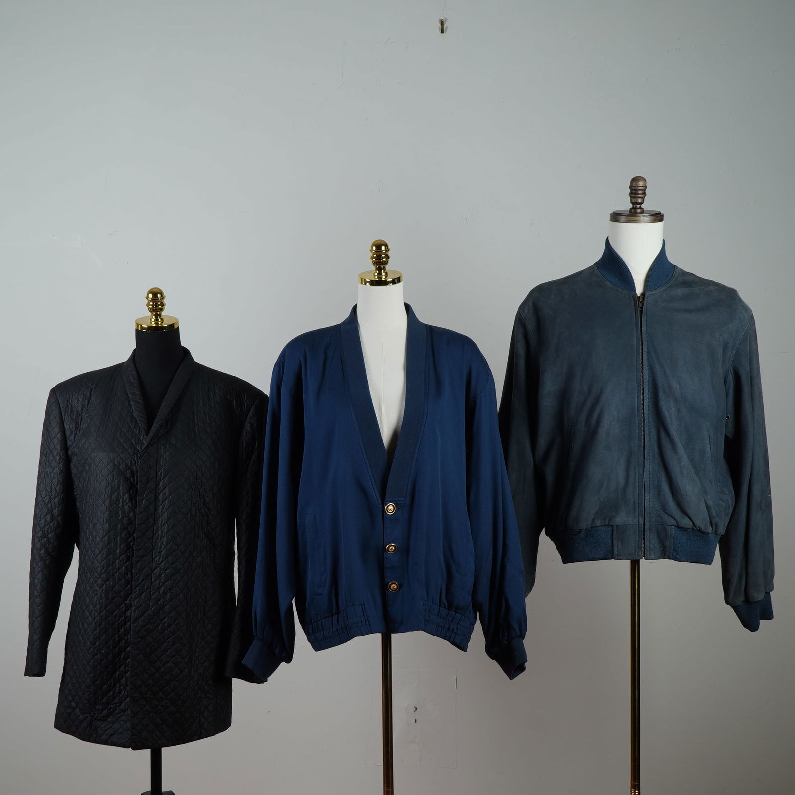 3pc Coach, Genelli, and Masatomo Leather and Silk Jackets: Includes a black quilted Masatomo coat with a subtle sheen and refined minimalist tailoring, a navy blue Genelli jacket crafted of soft silk with a relaxed draped silhouette and gold-tone buttons. Als