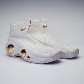 A Pair of Nike Flight Bonafide Rose Gold Sneakers