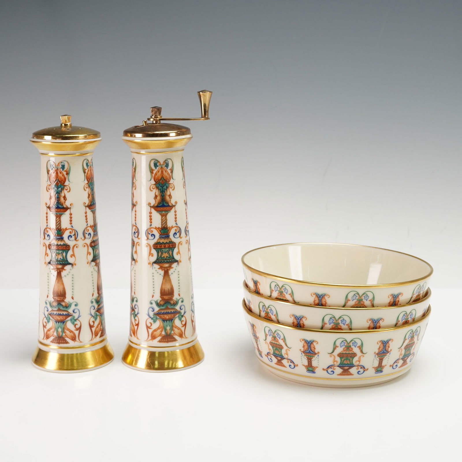 5pc Lenox Lido Dinnerware, Salt Mill, Pepper Mill, & Individual Salad Bowls: Including one salt mill, one pepper mill, and three individual salad bowls. Each piece features a cream porcelain body adorned with an ornate multicolor vase and scroll motif, accented with gold trim.