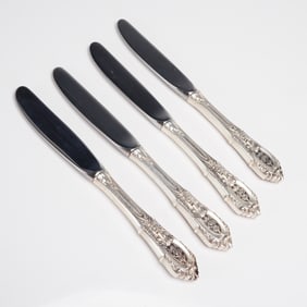 A Collection of 4 Wallace Rose Point Sterling Handle Table Knives