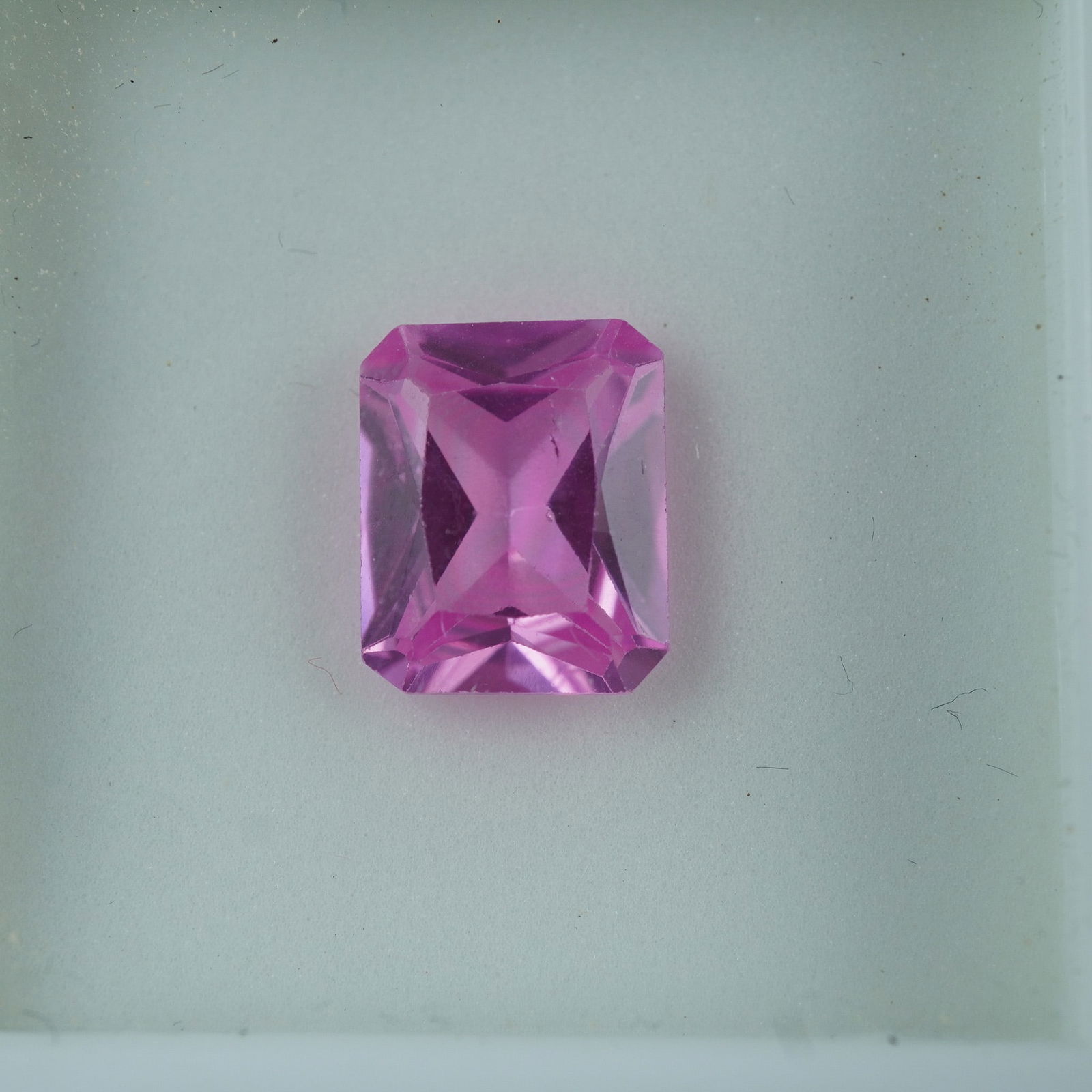4.00 CT Lab-Created Pink Sapphire Emerald Cut Gemstone: Lab-created pink sapphire in a vibrant emerald cut, showcasing excellent clarity and brilliance. This eye-catching gem offers the beauty of natural sapphire at an accessible price, perfect for bold je