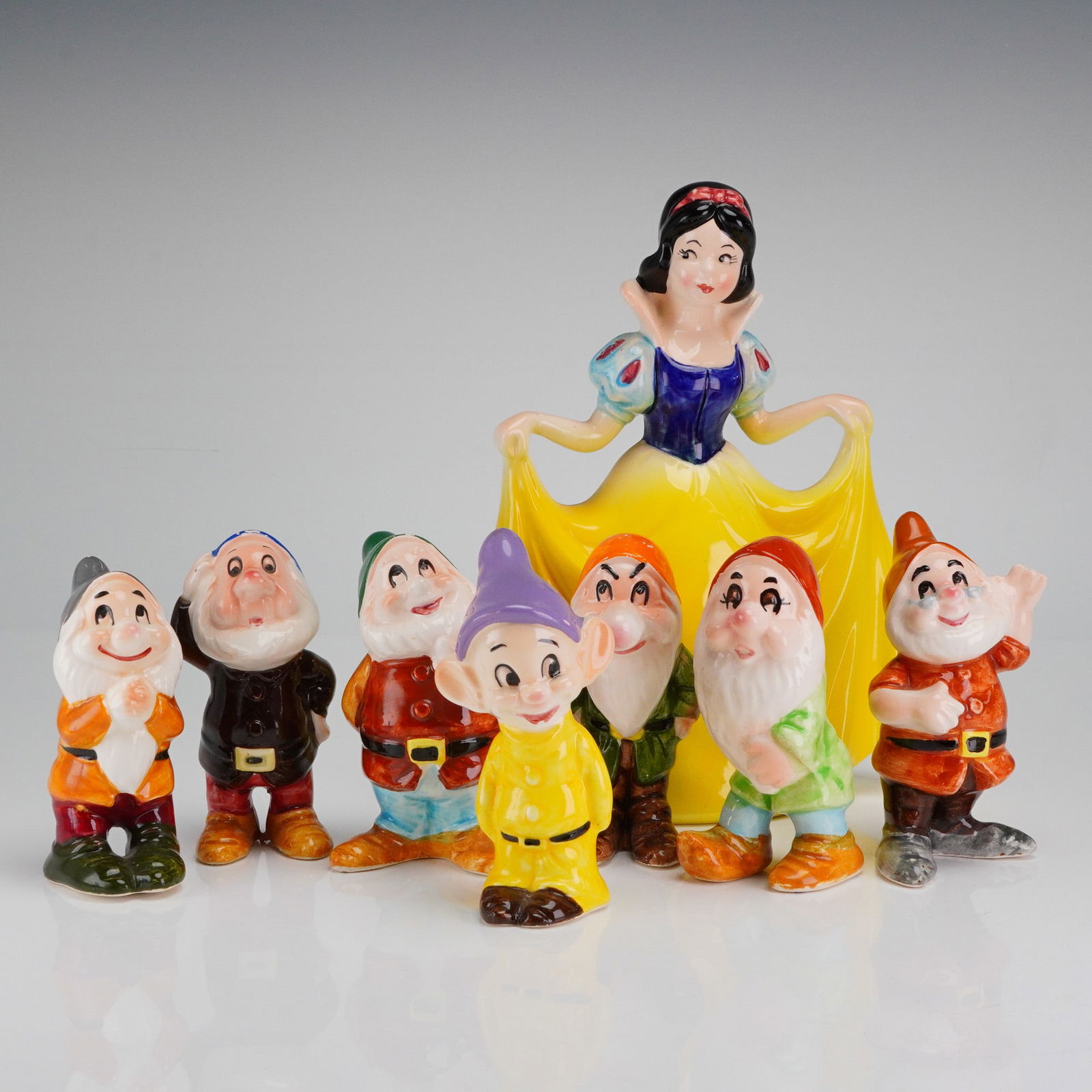 8 Snow White & Seven Dwarfs Figurine Set, Japan: A complete 8-piece cold painted collection of vintage Walt Disney's Snow White & the Seven Dwarfs figurines. The set includes the central figure of Snow White and all seven individual dwarf charac