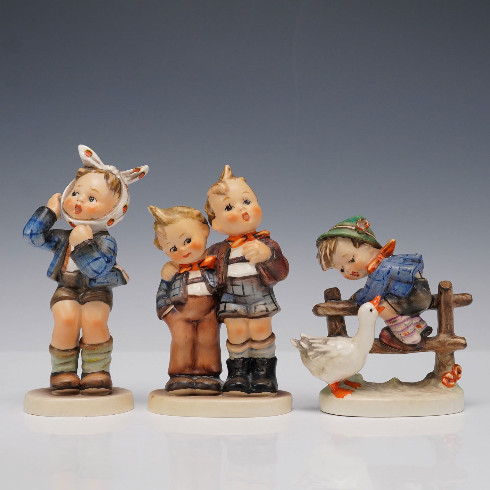 3pc Goebel Hummel Figurines, Max & Moritz, Boy w Toothache, Barnyard Hero: Charming set of three vintage Goebel Hummel porcelain figurines featuring beloved characters and scenes. Includes "Max and Moritz" with two mischievous boys in coordinated outfits, "Boy with Toothache