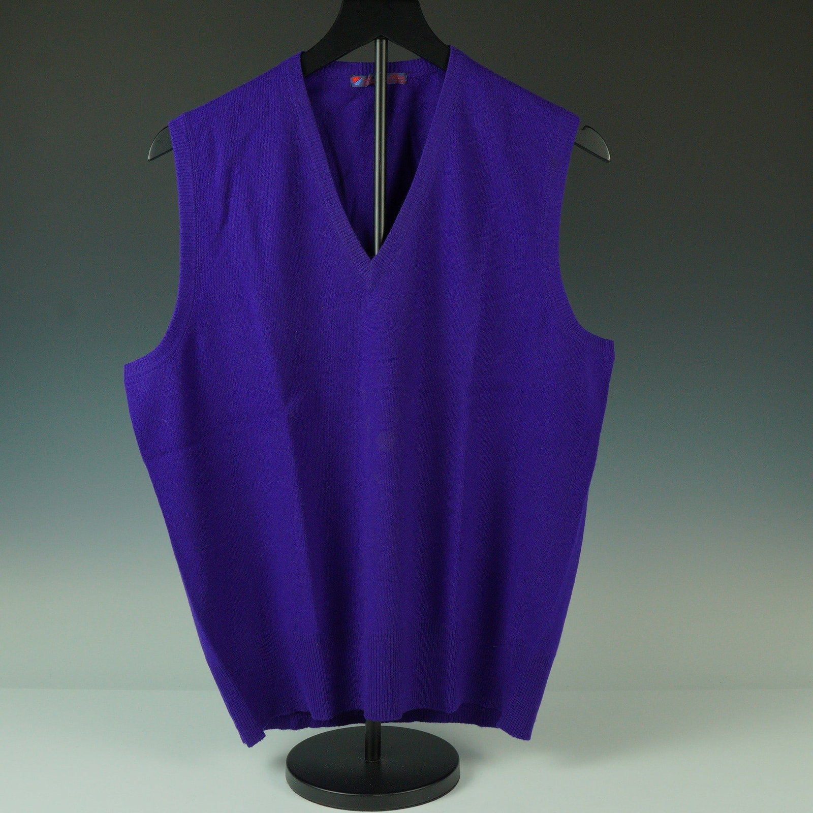 Fedeli Purple Cashmere Sweater Vest: Crafted from 100% pure cashmere spun in Scotland, this luxurious V-neck sweater vest by Fedeli is presented in a vivid royal purple and finished under the label "Red and Blue, Monte Napoleone, Milano"