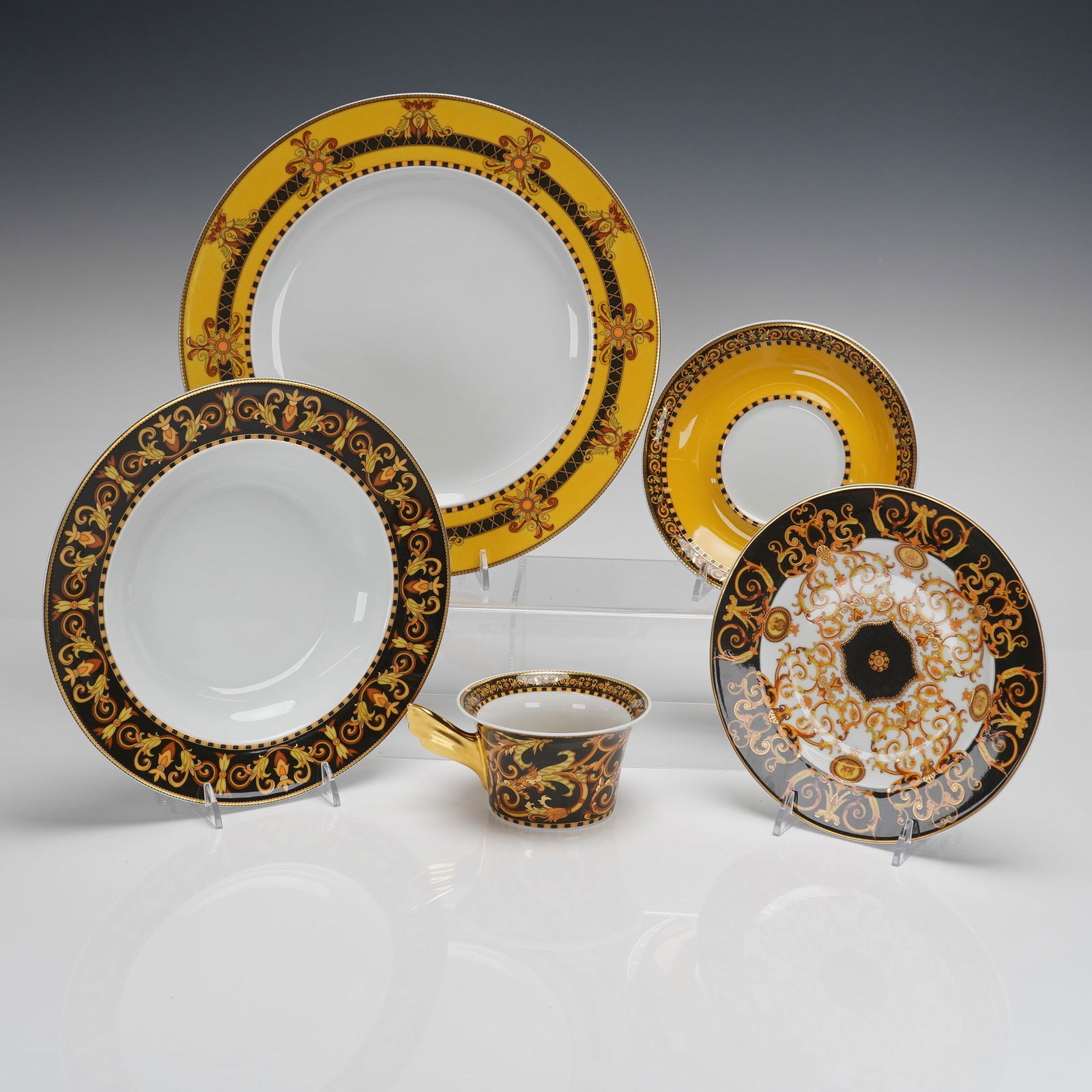 A 5-Piece Rosenthal Versace Barocco Dinnerware Place Setting: A 5pc Rosenthal Versace Barocco dinnerware place setting, executed in porcelain as part of the Rosenthal studio-linie collaboration with Versace. The set comprises five pieces: one large dinner plate,