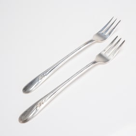 A Pair of Holmes & Tuttle Meadow Flower Silverplate Cocktail Forks