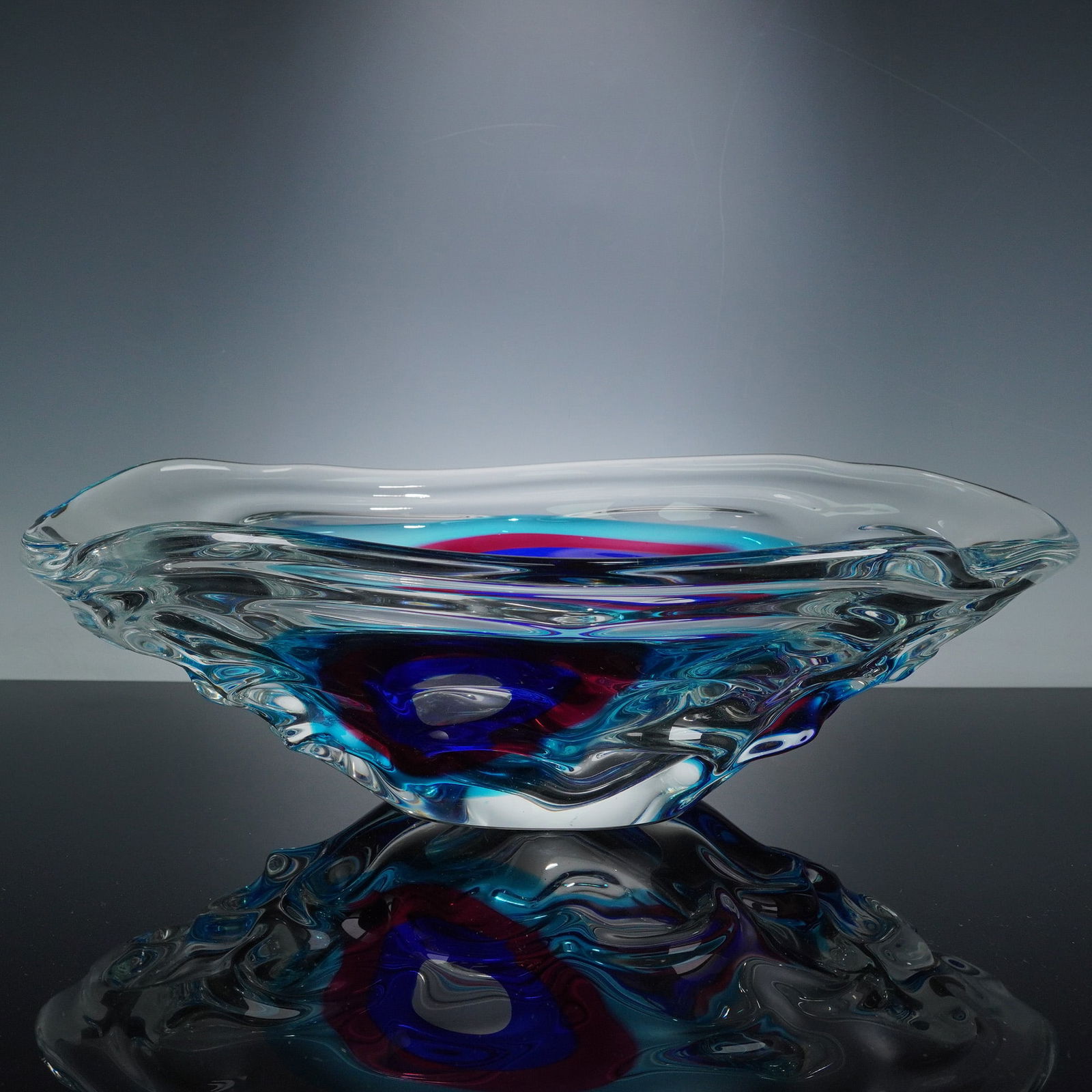 Jan Beranek Czech Art Glass Oval Bowl Teal Purple Blue: A substantial Czech art glass centerpiece bowl attributed to Jan Beranek, likely dating to the Mid-Century Modern or Contemporary period. The piece is constructed of thick, heavy clear glass, executed