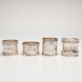 A Collection of Four Assembled Sterling Silver Napkin Rings