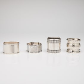 A Collection of Four Mixed Sterling Silver Napkin Holders