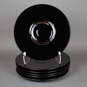 A Collection of Six Black Glass Chargers