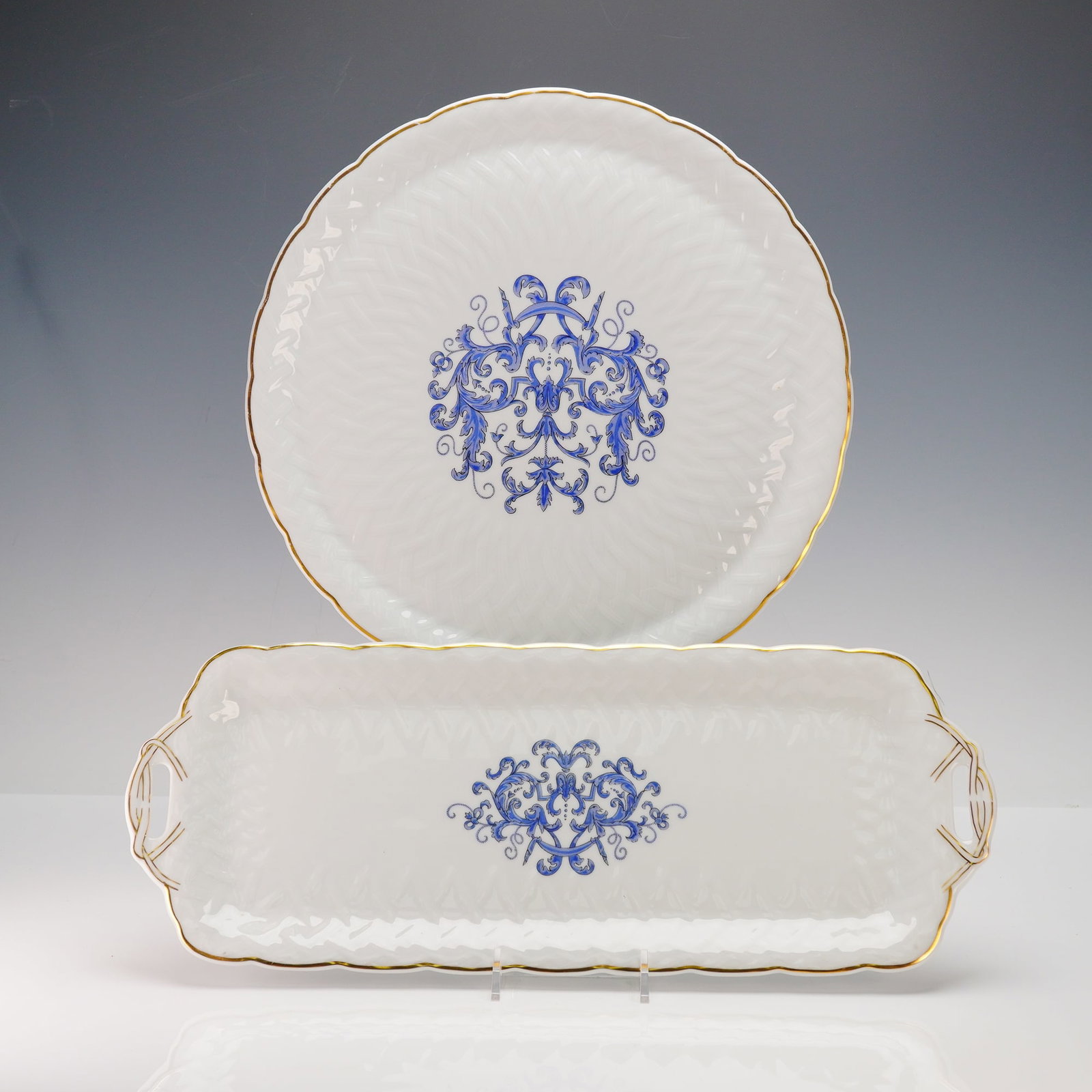 A Pair of Bernardaud & Co. Limoges 'Louis XIII' Porcelain Serving Wares: A pair of French porcelain serving wares by Bernardaud & Co. Limoges, in the 'Louis XIII' pattern. Comprising a round platter/charger with a scalloped edge and a rectangular tray with integral handles